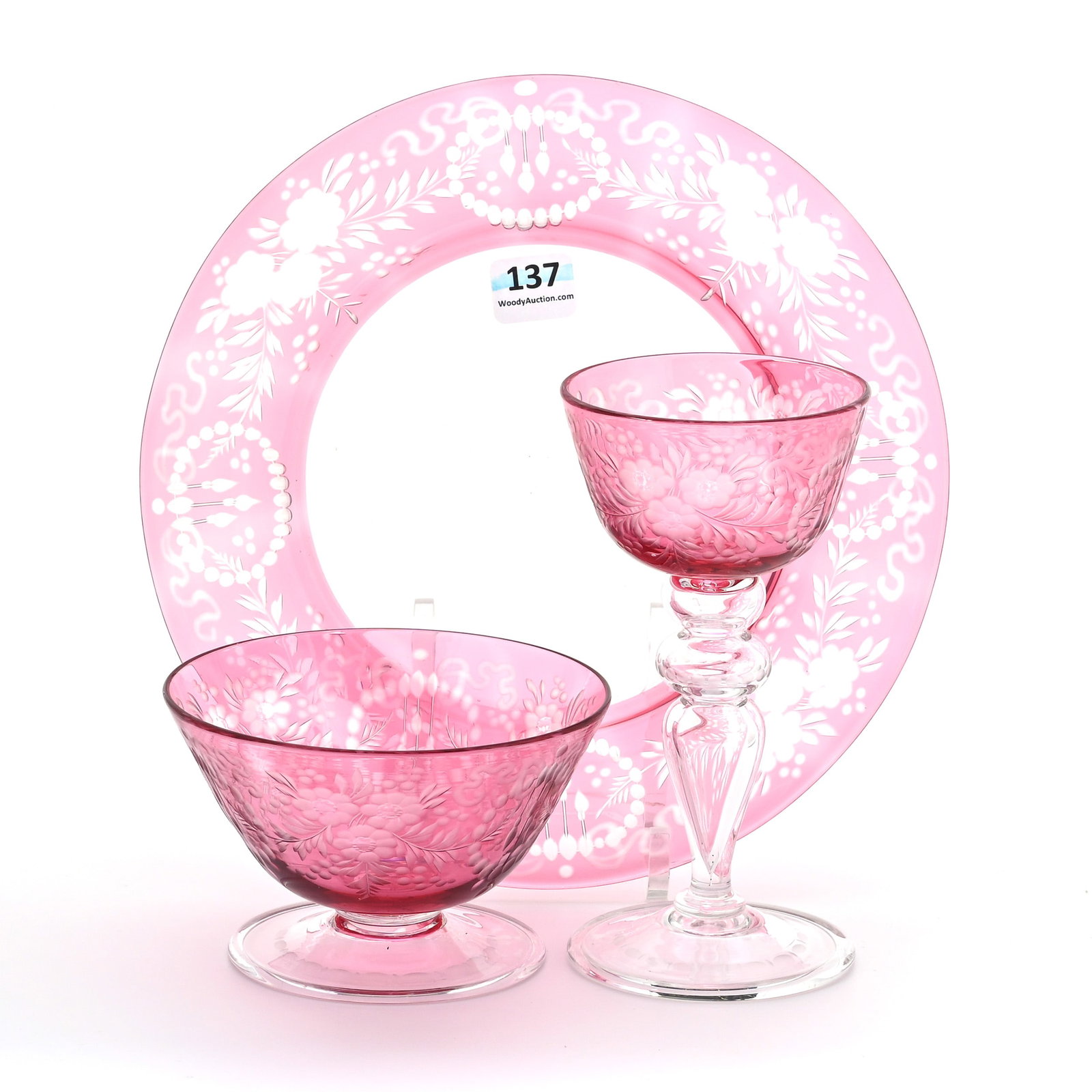 (3) Signed Steuben Cranberry Cut To Clear Items: (3) Signed Steuben Cranberry Cut To Clear Items, All Have Same Pattern Of Engraved Floral Garland With Medallion And Ribbon Highlights, (1) 8.5" Plate, No Signature, (1) 6" Wine Stem, (1) 2.75" Sherbe