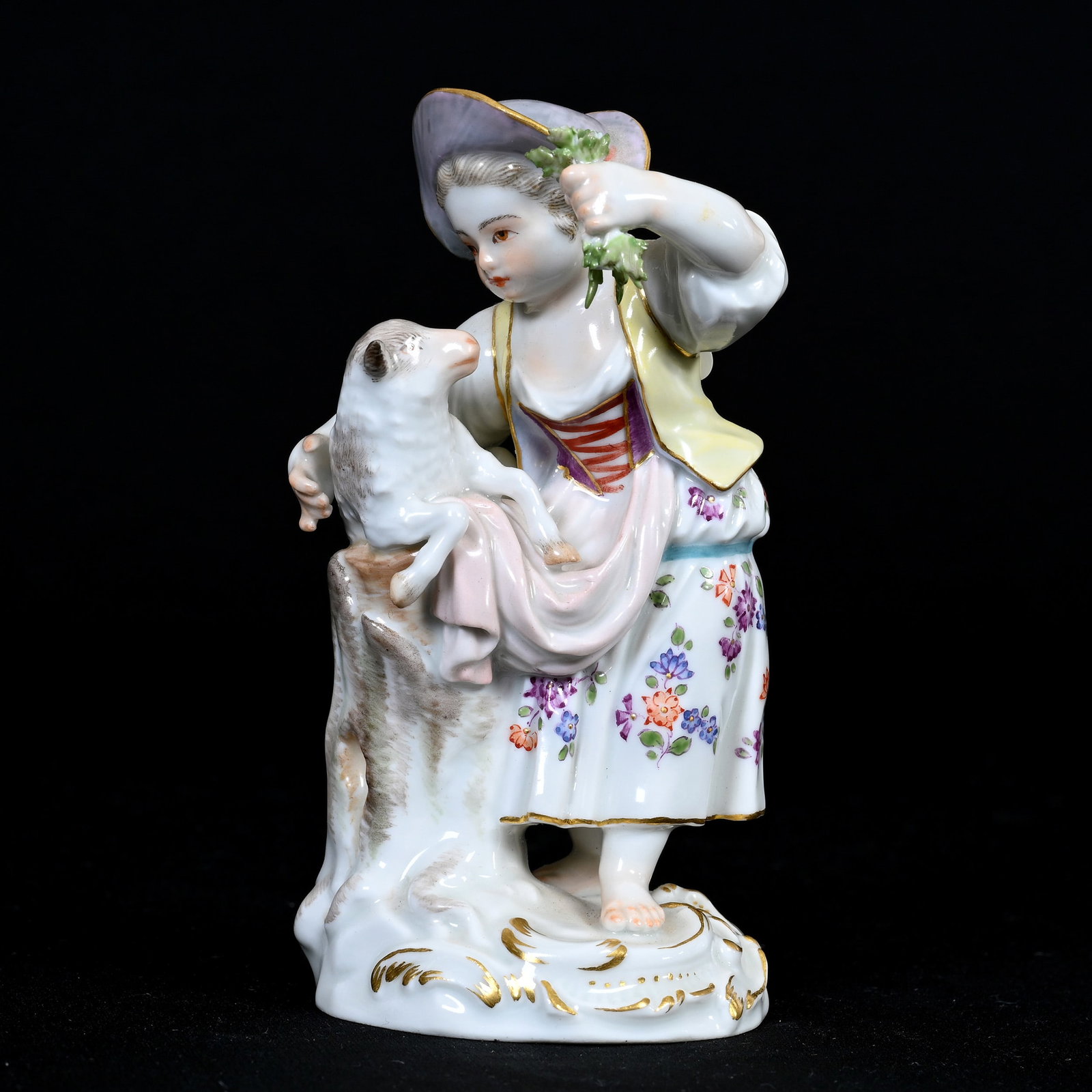 Figurine Marked Meissen #F20 (Blue Crossed Swords): Figurine Marked Meissen #F20 (Blue Crossed Swords), 4.75" x 2.5", Young Girl Feeding Lamb, Small Leaf Chip, This Item Sold In A Previous Woody Auction, However Buyer Did Not Complete Transaction, Davi