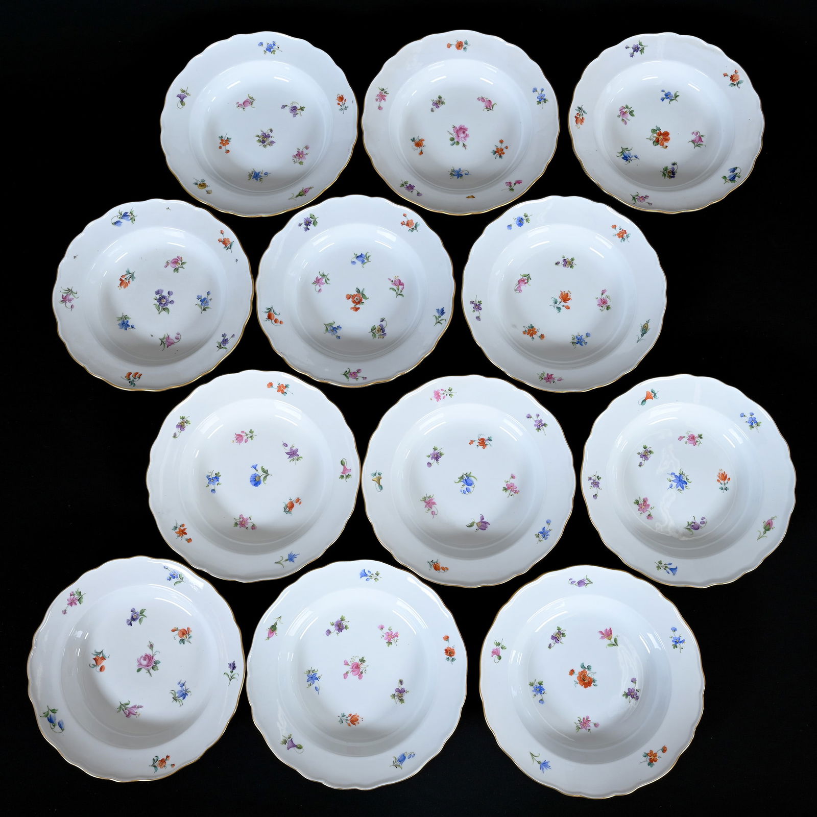 (12) Soup Bowls, Meissen Blue Crossed Swords Mark: (12) Soup Bowls, Meissen Blue Crossed Swords Mark, 9.25", Strewn Flowers Pattern, Very Nice Set, One Bowl Has Repaired Rim Chip, Frank Cox Estate, Denver, Colorado.