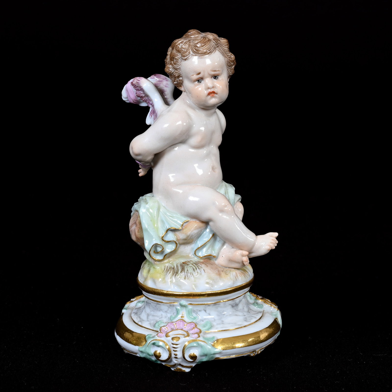 Figurine, Meissen Blue Crossed Swords Mark: Figurine, Meissen Blue Crossed Swords Mark, 4.25" x 2.25", Tied Up Cherub, Incised "M104", Frank Cox Estate, Denver, Colorado.