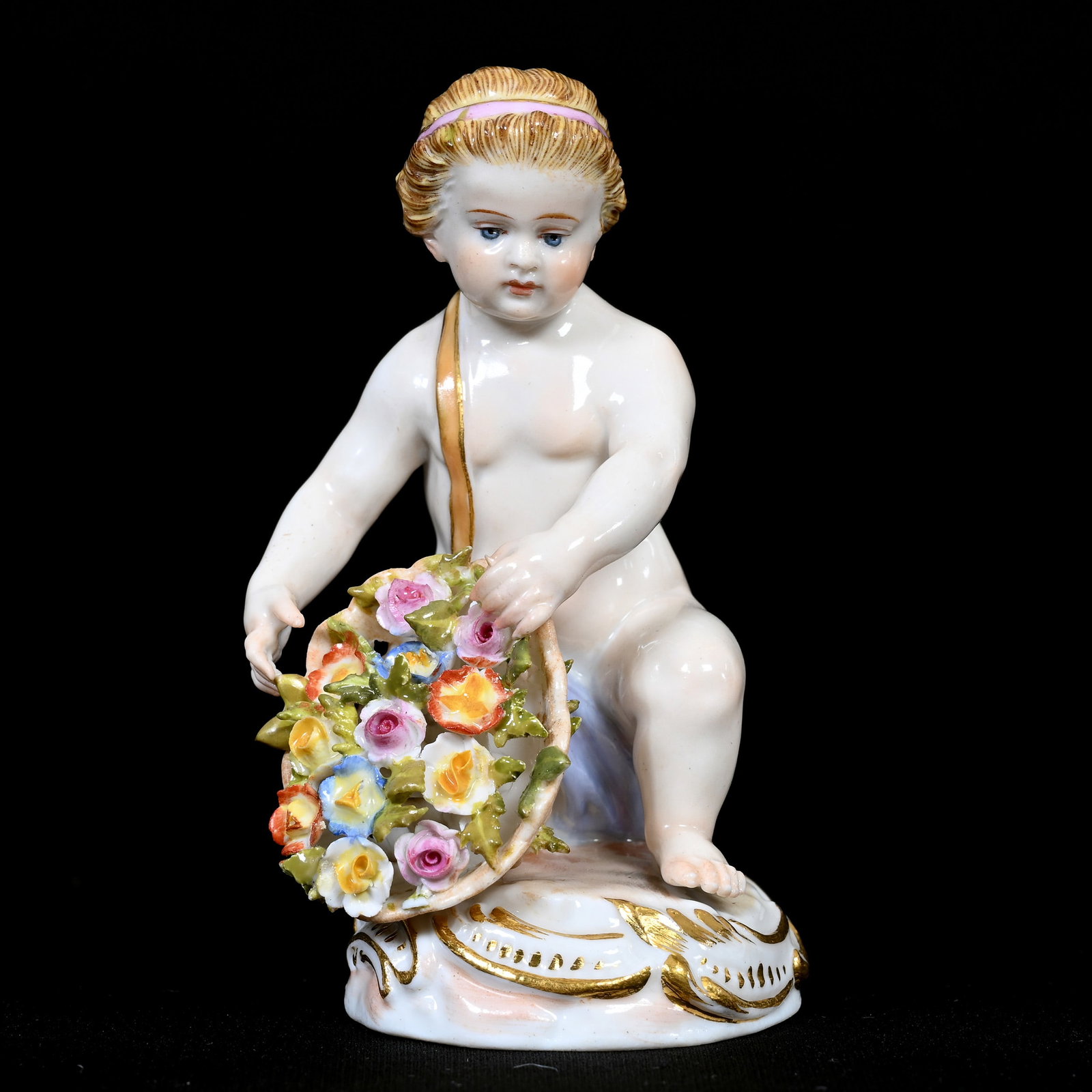 Figurine, Meissen Blue Crossed Swords Mark: Figurine, Meissen Blue Crossed Swords Mark, 3.25" x 2", Cherub Spilling Basket Of Flowers, Incised "B50", Frank Cox Estate, Denver, Colorado.