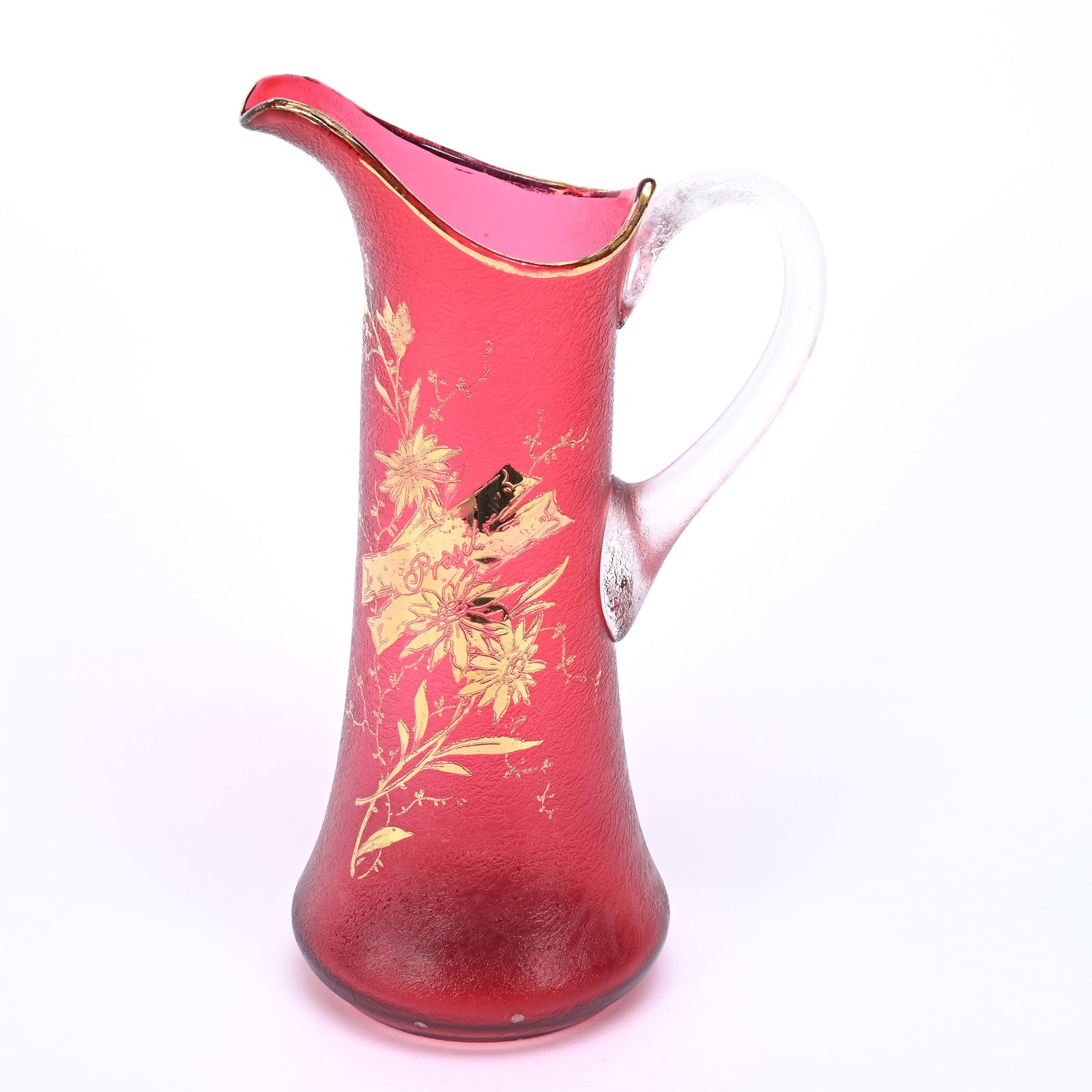 Tankard, Cranberry Art Glass: Tankard, Cranberry Art Glass, 13" x 7.75", Textured Exterior, Gilded Floral Decor With Banner "Crosit", Clear Textured Handle, Polished Pontil Base, Frank Cox Estate, Denver, Colorado.