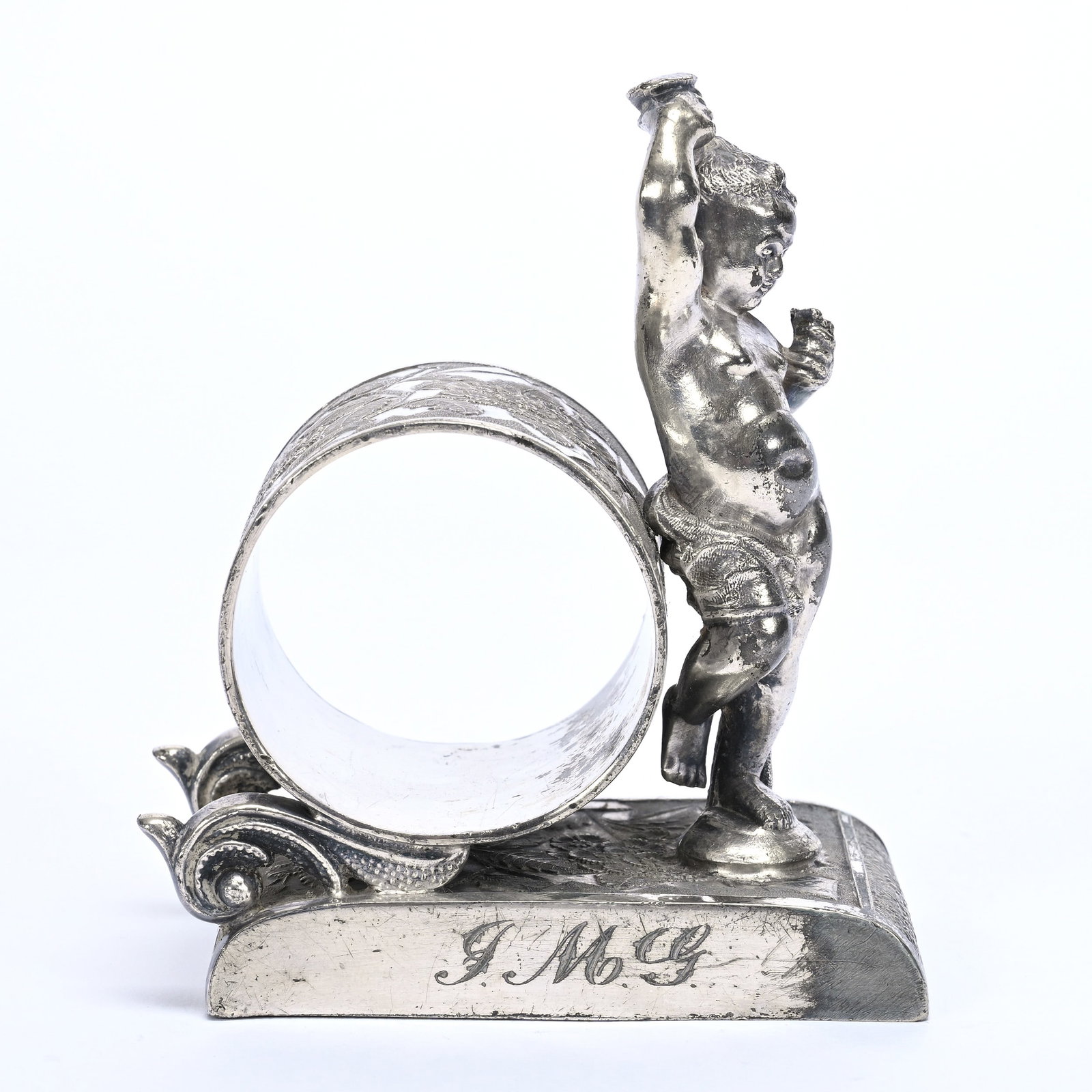 Figural Napkin Ring, Putti Drinking Wine: Figural Napkin Ring, Putti Drinking Wine, 4" x 3.5", Rockford #101 Silverplate, Dated 1902, Private Illinois Collection.