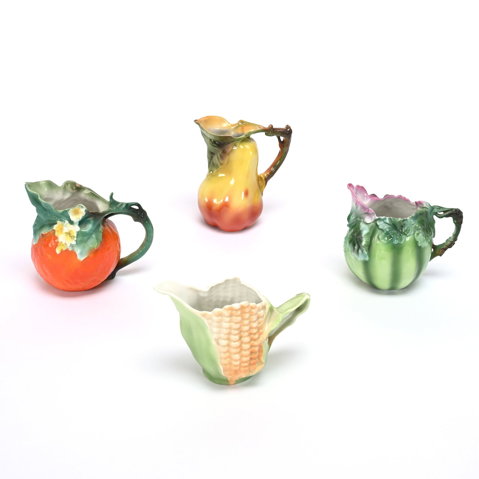 (4) Creamers, Royal Bayreuth Blue Mark: (4) Creamers, Royal Bayreuth Blue Mark, (1) 4.25" Orange, (1) 4" Watermelon, (1) 3.5" Corn, (1) 4.5" Pear, Unmarked, Private Illinois Collection.