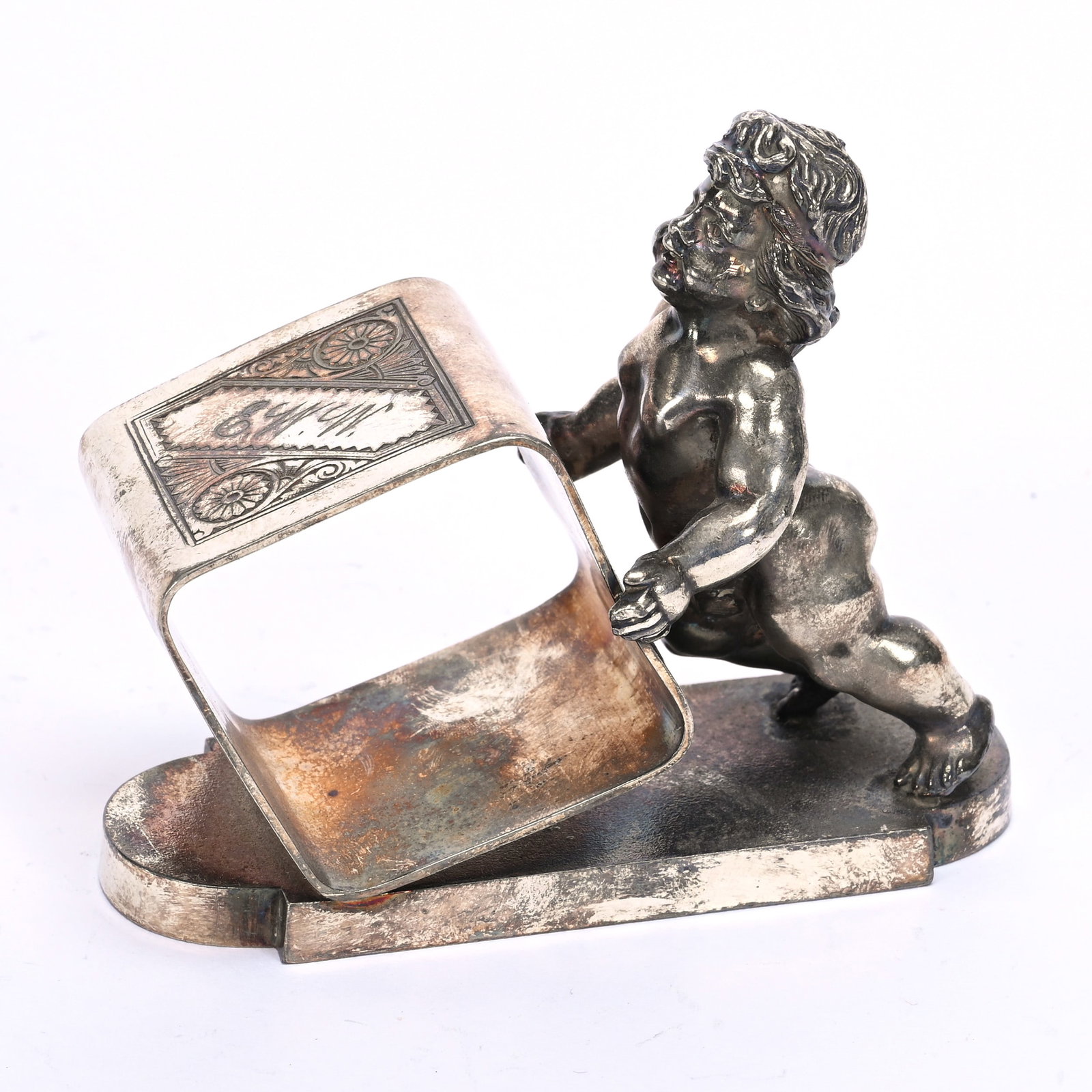 Figural Napkin Ring, Naked Baby Pushing Square Ring: Figural Napkin Ring, Naked Baby Pushing Square Ring, 3.25" x 3.75", Tufts #1548 Silverplate, Private Illinois Collection.