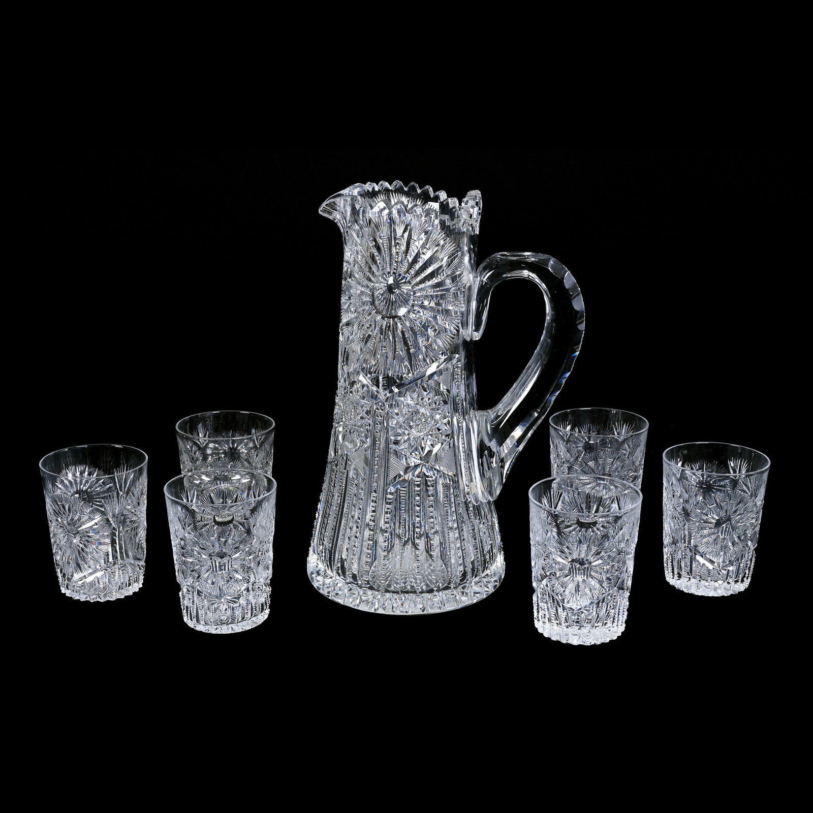 Water Set, American Brilliant Cut Glass, Sunburst Pattern: Water Set, American Brilliant Cut Glass, Sunburst Pattern, Hobstar, Strawberry Diamond And Prism Highlights, (1) 11.5" x 7.5" Pitcher, Double Notched Handle, Hobstar Base, (6) Matched 4.75" Tumblers, 