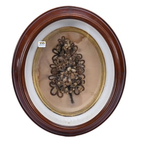 Elaborate Oval Walnut Frame
