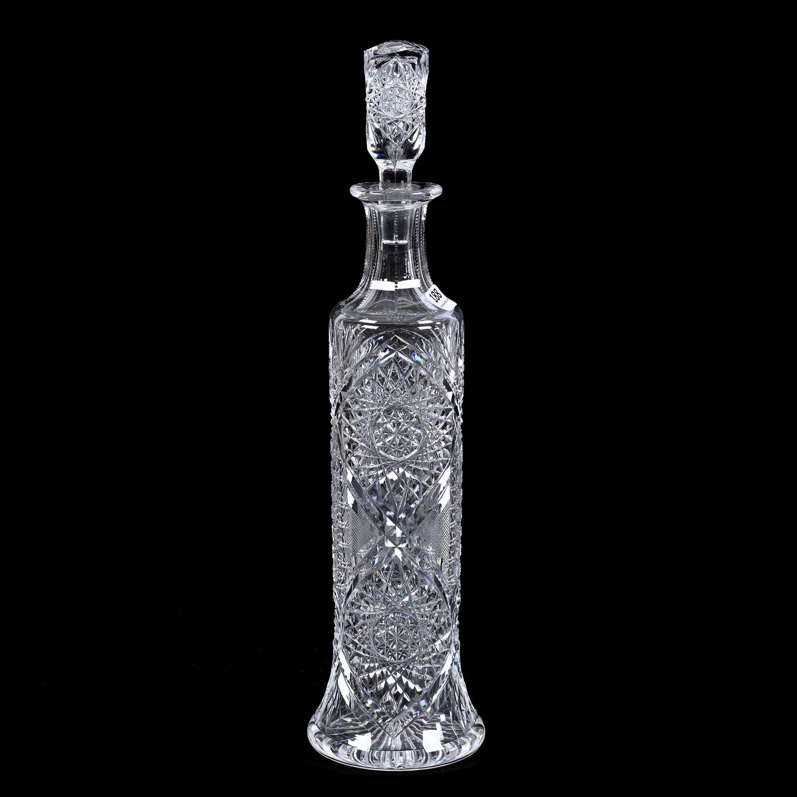 Whiskey Decanter, American Brilliant Cut Glass: Whiskey Decanter, American Brilliant Cut Glass, 15.75" x 4", Hobstar, Strawberry Diamond, Cane, Vesica, Prism And Fan Motif, Pattern Cut Stopper, Ray Cut Base, Linda & The Late Gary Maddox, NC.