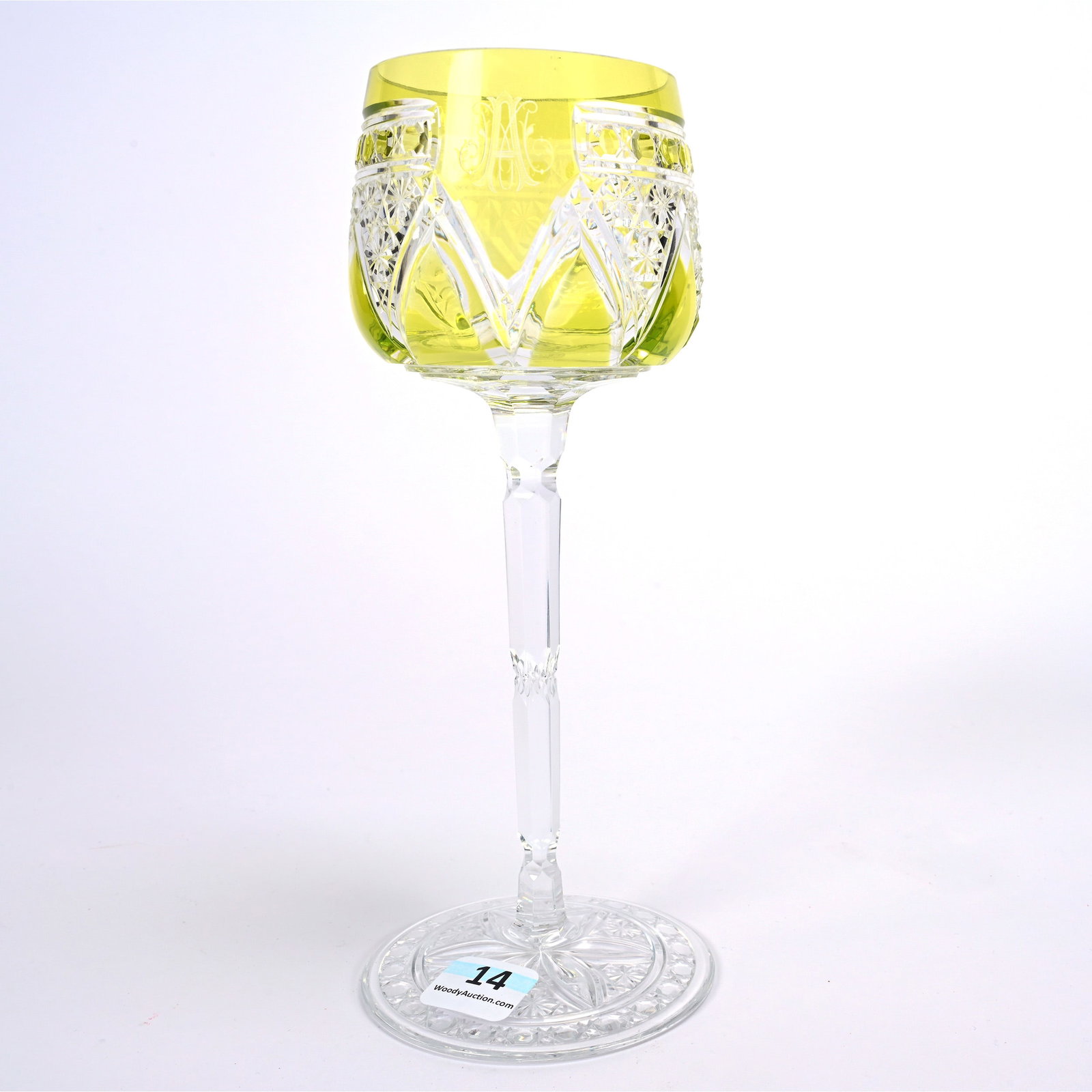 Wine Stem, BPCG, Yellow Cut To Clear Signed Baccarat: Wine Stem, Brilliant Period Cut Glass, Yellow Cut To Clear Signed Baccarat, 7.75" x 3.125", Elaborate Engraved Monogram, Pattern Cut Foot, American Cut Glass Association Collection.