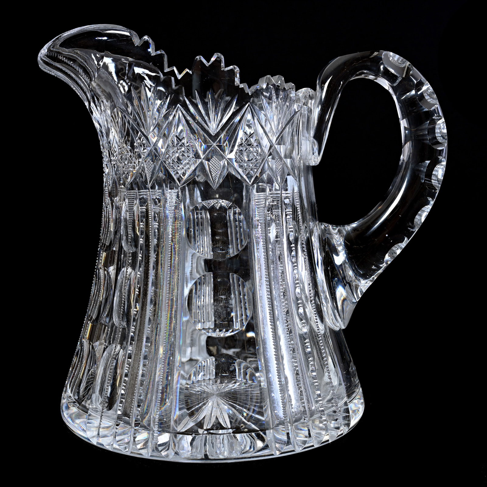 Pitcher, ABCG, Alternating Panels Of Bullseye & Prism With Geometric Cut Border: Pitcher, American Brilliant Cut Glass, Alternating Panels Of Bullseye & Prism With Geometric Cut Border, 8" x 8.25", Double Notched Handle, Ray Cut Base, Clear Blank, Indiana Private Collection.