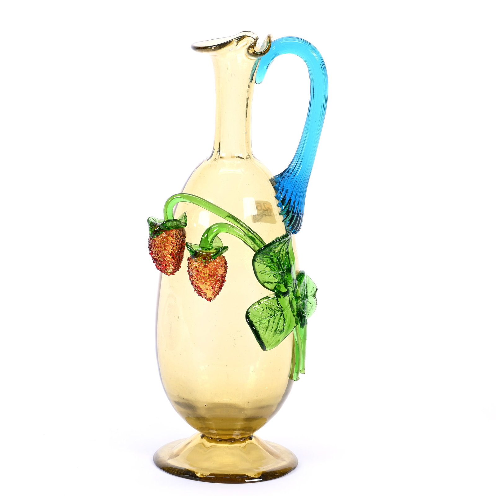 Pedestal Decanter, Solid Amber With Applied Blue Ribbed Handle, Applied Strawberry/Leaf Decor: Pedestal Decanter, Solid Amber With Applied Blue Ribbed Handle, Applied Strawberry/Leaf Decor, 12" x 4.5", No Stopper, Point Of One Leaf Has Chip, Ray Callander Collection.