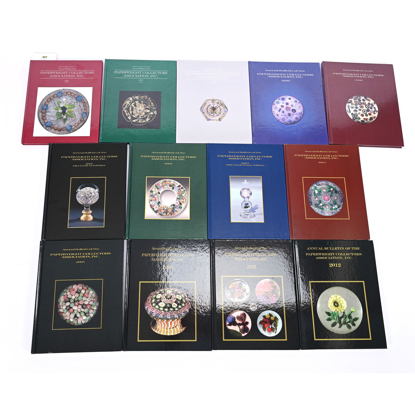 (13) Annual Bulletins Of The Paperweight Collectors Association Inc.: (13) Annual Bulletins Of The Paperweight Collectors Association Inc., All With Hardbound Covers, Dates Includes 1996 Thru 2005, 2010, 2011 & 2012, Willa (Billie) Harrington Collection.
