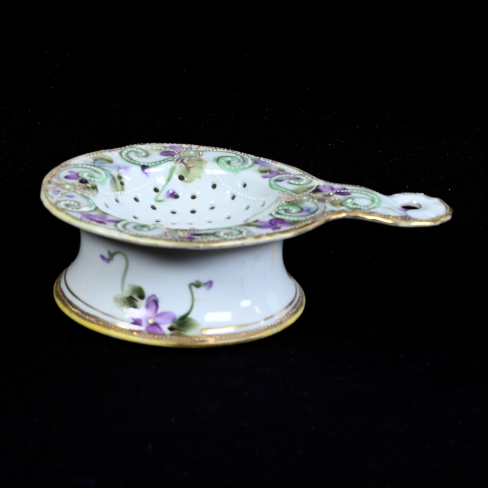 Tea Strainer, Two Part, Nippon Maple Leaf Mark, White With Green Scroll and Violet Floral Decor: Tea Strainer, Two Part, Nippon Maple Leaf Mark, White With Green Scroll and Violet Floral Decor, 1.75" x 6", Kansas Private Collection.