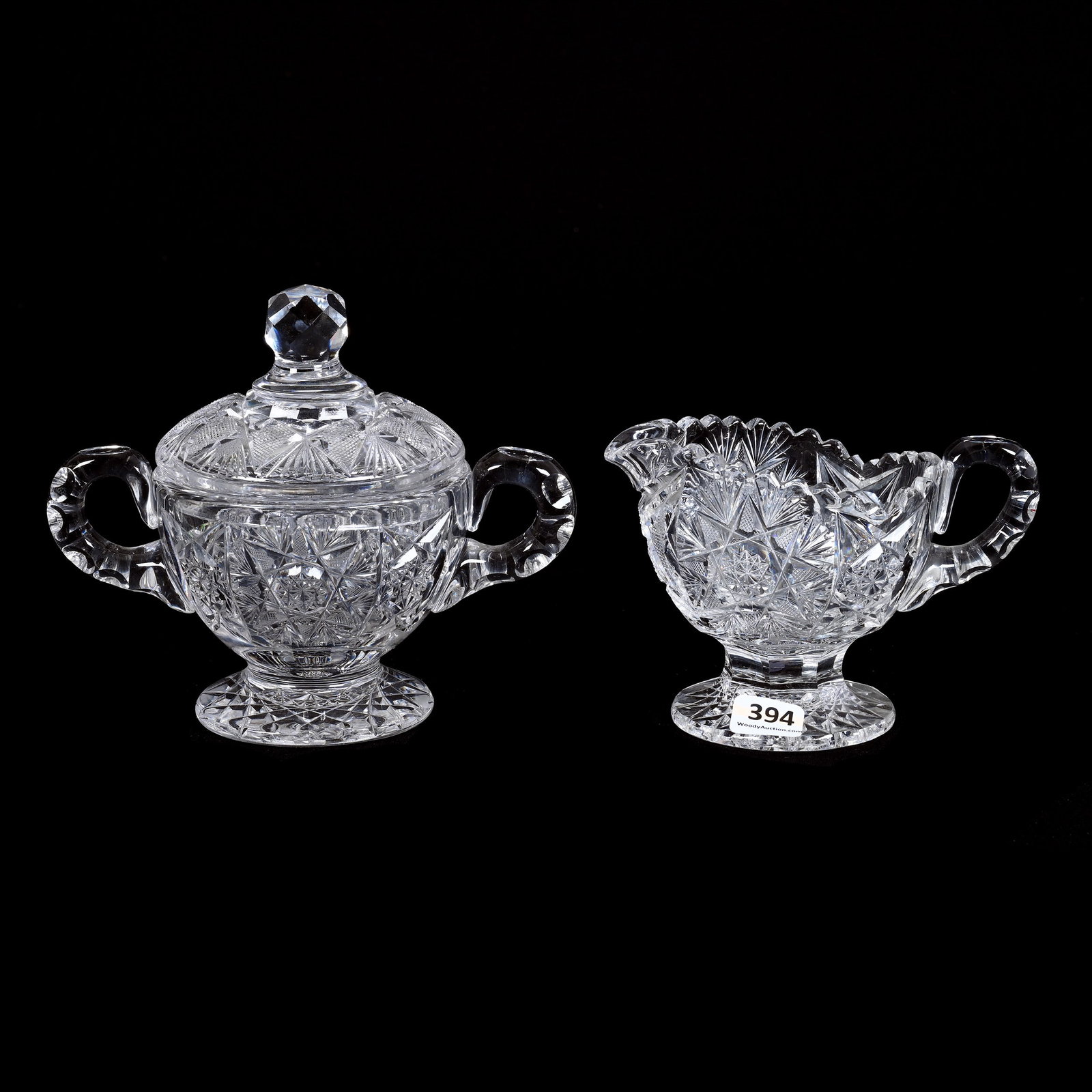 Pedestal Creamer & Covered Sugar, ABCG, Flashed Hobstar, Double Notched Handle: Pedestal Creamer and Covered Sugar, American Brilliant Cut Glass, Flashed Hobstar, Double Notched Handle, 5.5" x 6.5", Hobstar Foot, Rim Chip On Creamer And One Sugar Lid, Collection Of David Fuchshub