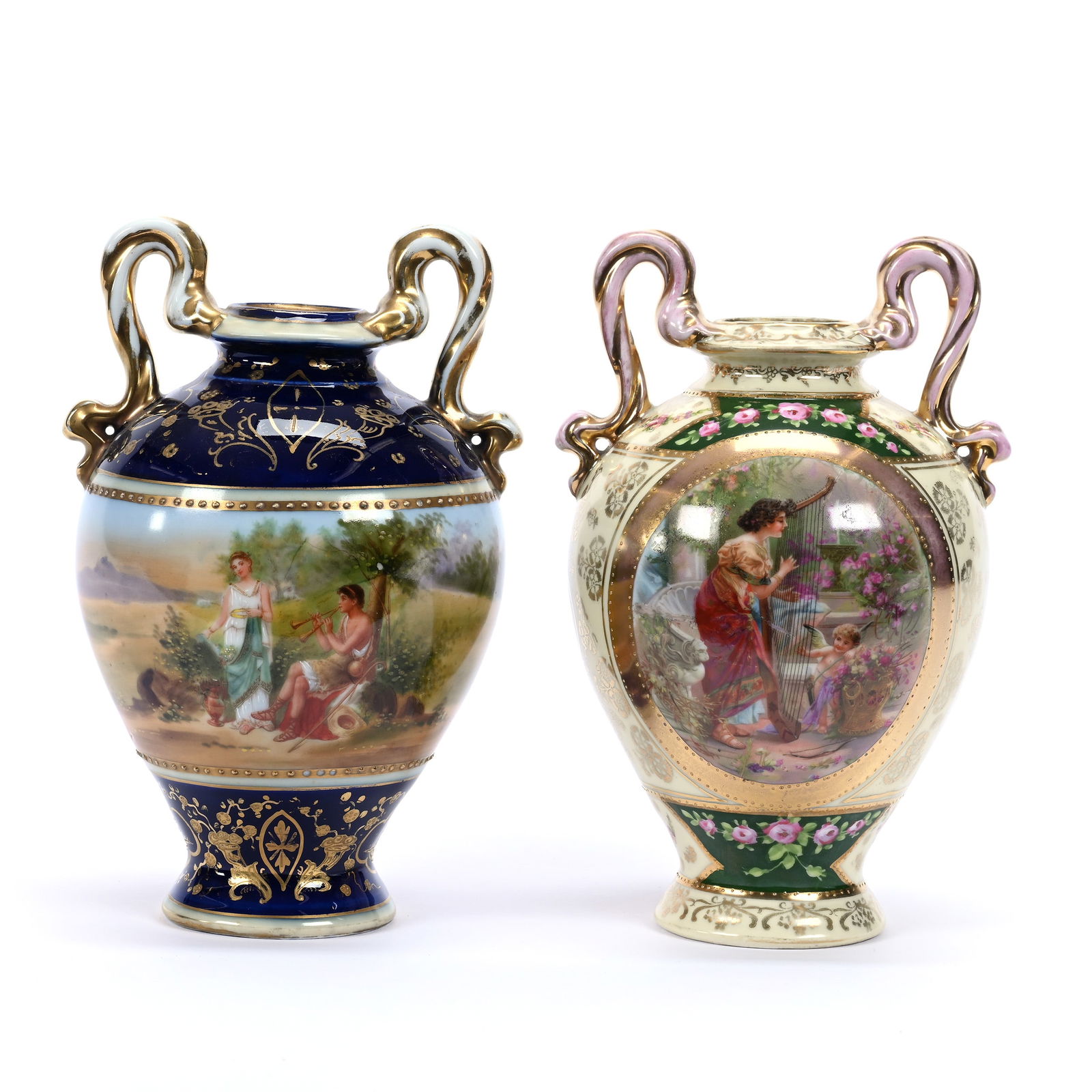 (2) Urns, Two Handles, Marked Royal Vienna Beehive: (2) Urns, Two Handles, Marked Royal Vienna Beehive, 8" x 5", (1) Cobalt Blue With Classic Courting Scene, (1) Cream And Green With Woman And Cherub Playing Harp, No Lids, Estate Of Marvin And Elfriede