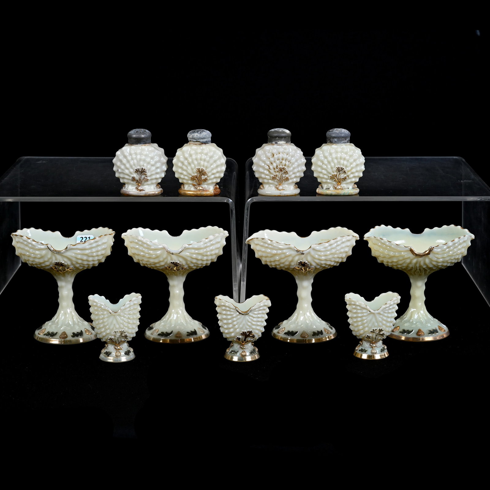 (11) Custard Glass Items In Argonaut Shell Pattern By Northwood: (11) Custard Glass Items In Argonaut Shell Pattern By Northwood, (4) 5" x 5" Compotes, (4) 3.25" Salt And Pepper Shakers, (3) 3" Toothpick Holders, Highly Reactive Under Black Light, Two Shakers Have 