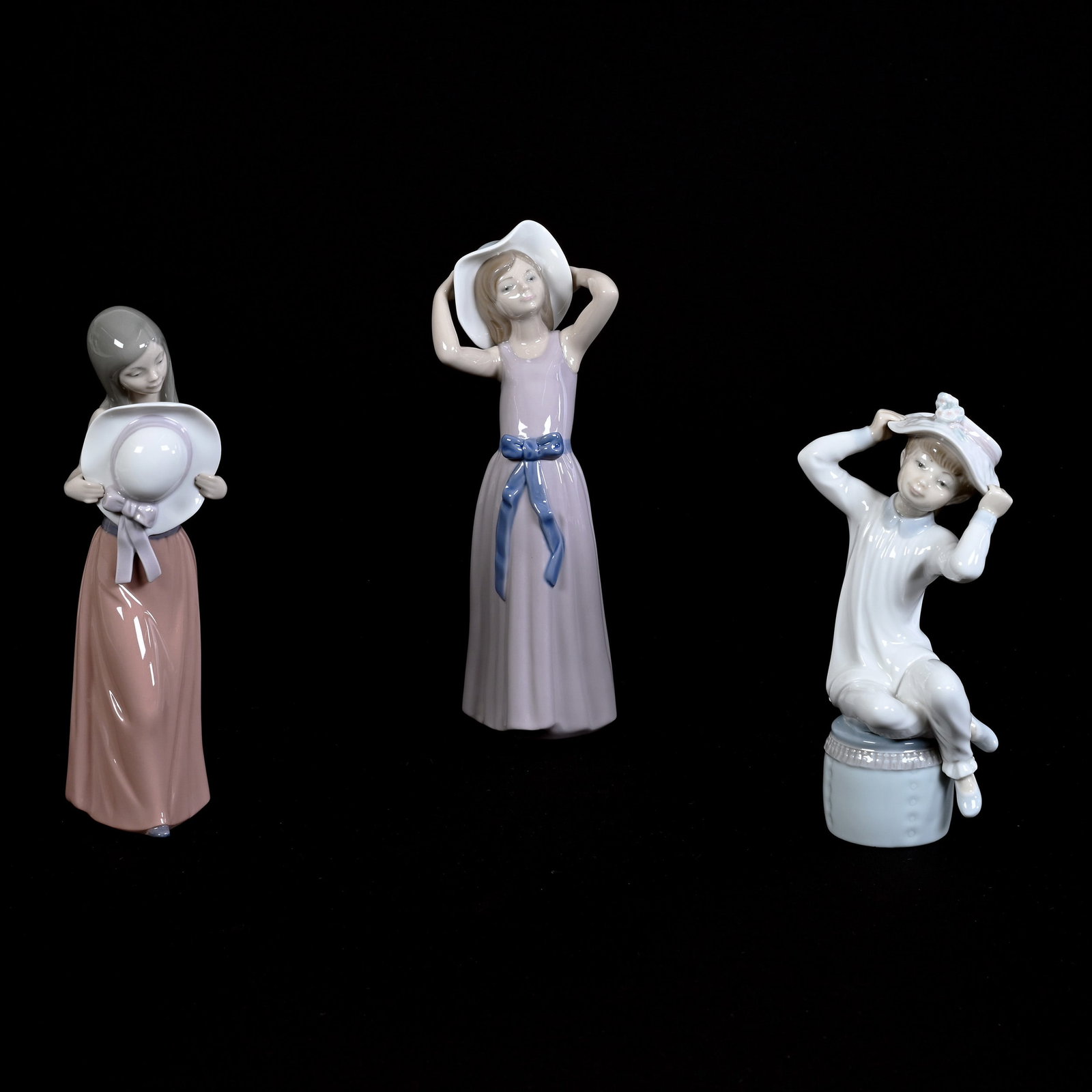 (3) Figurines Marked Lladro, Young Girls With Hats: (3) Figurines Marked Lladro, Young Girls With Hats, Heights From 10.5" To 8.5", Estate Of Marvin And Elfriede MIller, North Dakota.