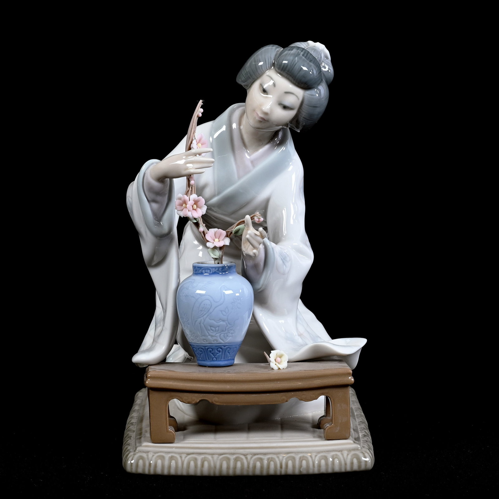 Figurine Marked Lladro Titled "Geisha Flower Arranger" #4840: Figurine Marked Lladro Titled "Geisha Flower Arranger" #4840, 7.5" x 4.5" x 6", Estate Of Marvin And Elfriede MIller, North Dakota.