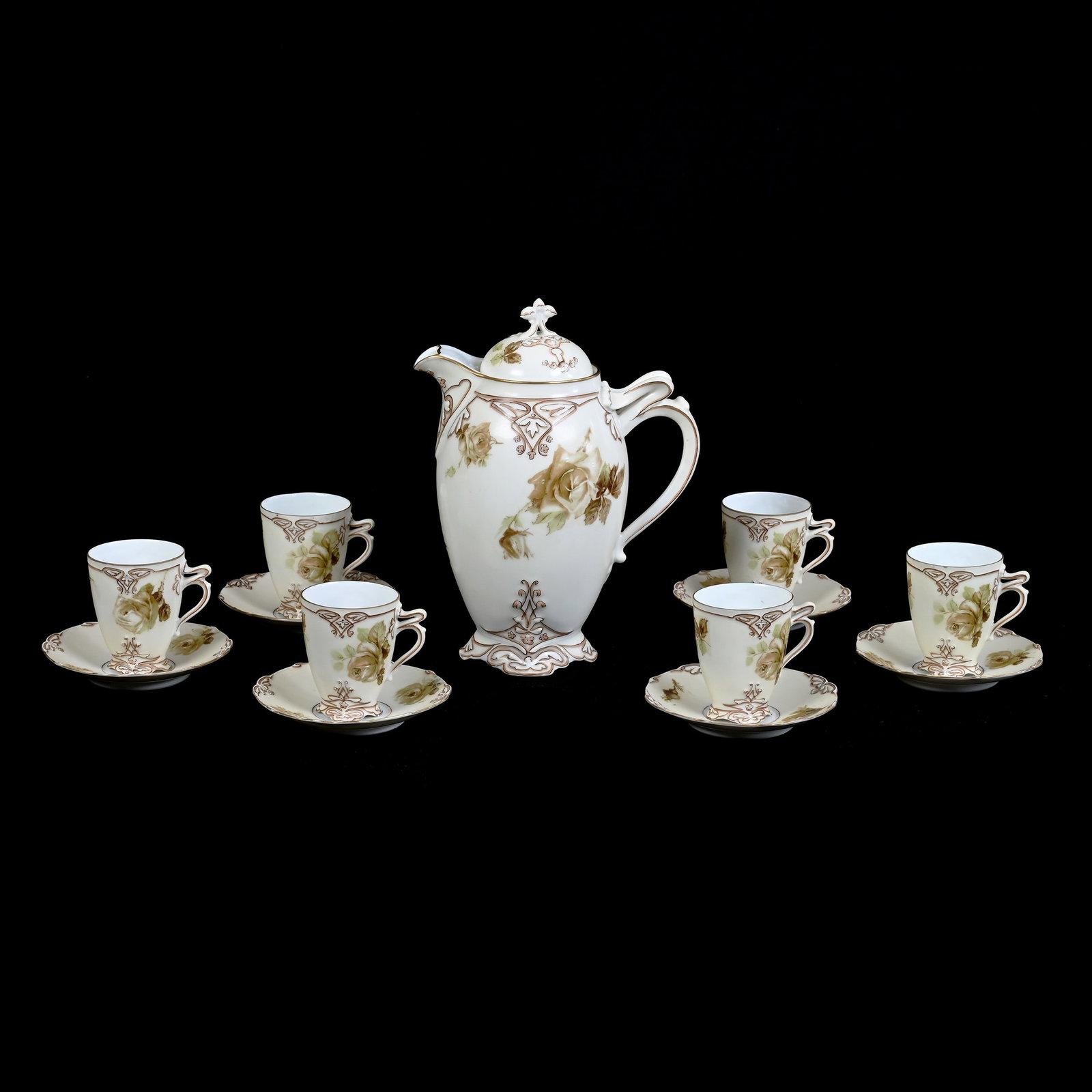 Chocolate Set, Old Ivory Pattern #16: Chocolate Set, Old Ivory Pattern #16, (1) 9.5" x 7" Chocolate Pot, (6) Matching Cups And Saucers, Estate Of Marvin And Elfriede MIller, North Dakota.