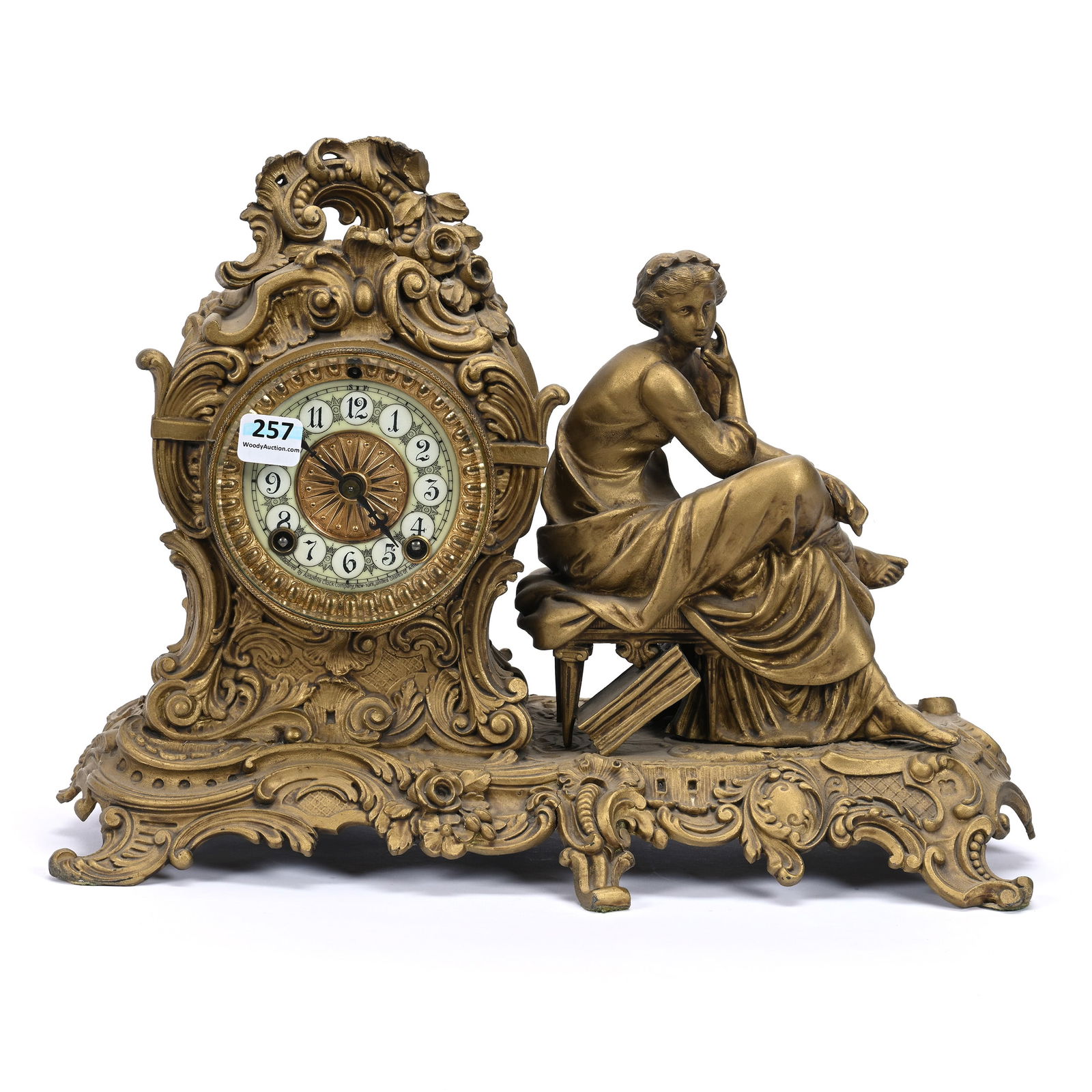 Mantel Clock, Gilt Metal Case With Woman Seated On Stool, Ansonia Clock Works: Mantel Clock, Gilt Metal Case With Woman Seated On Stool, Ansonia Clock Works, 10.5" x 14.5", Estate Of Marvin And Elfriede MIller, North Dakota.