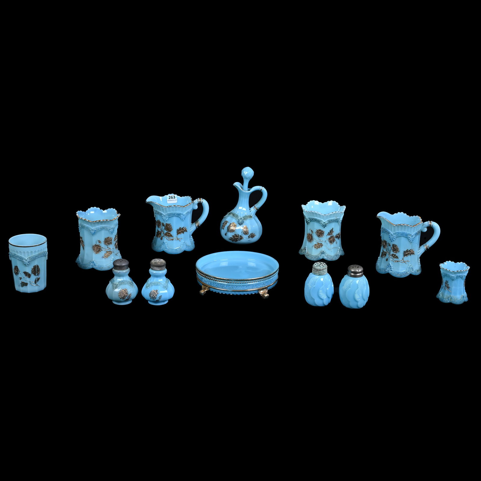 (10) Items, Blue Custard Chrysanthemum Sprig Pattern By Northwood: (10) Items, Blue Custard Chrysanthemum Sprig Pattern By Northwood, (2) Creamers, (2) Spooners, (1) Cruet, (1) Salt And Pepper, (1) Tumbler, (1) Toothpick Holder, (1) 6.5" Condiment Tray With Base Nick