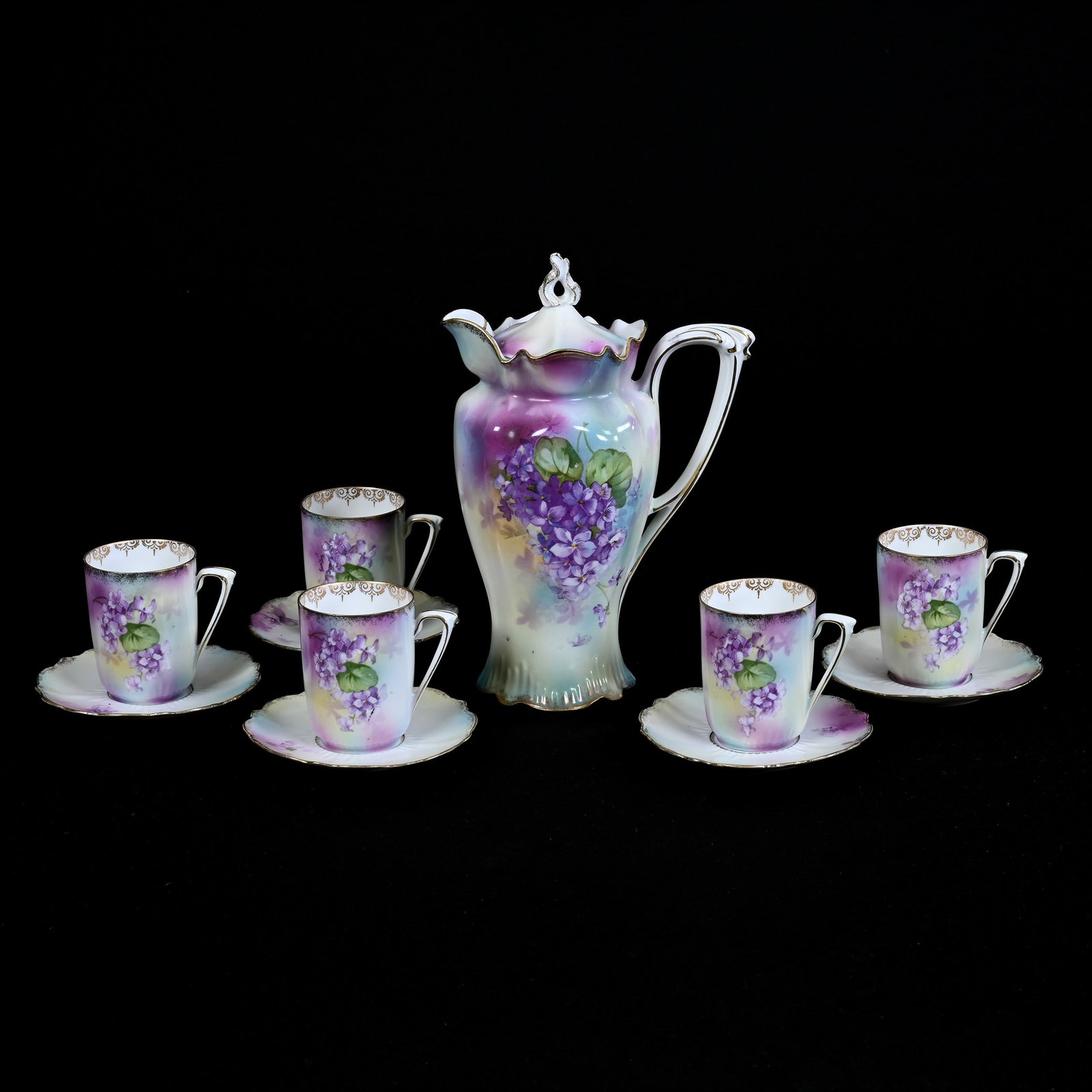 Chocolate Set Marked R.S. Prussia, Lavender, Green And Yellow Tones, Violet Decor: Chocolate Set Marked R.S. Prussia, Lavender, Green And Yellow Tones, Violet Decor, (1) 9.25" x 6.25" Chocolate Pot, (5) Matching Cups And Saucers, Estate Of Marvin And Elfriede MIller, North Dakota.