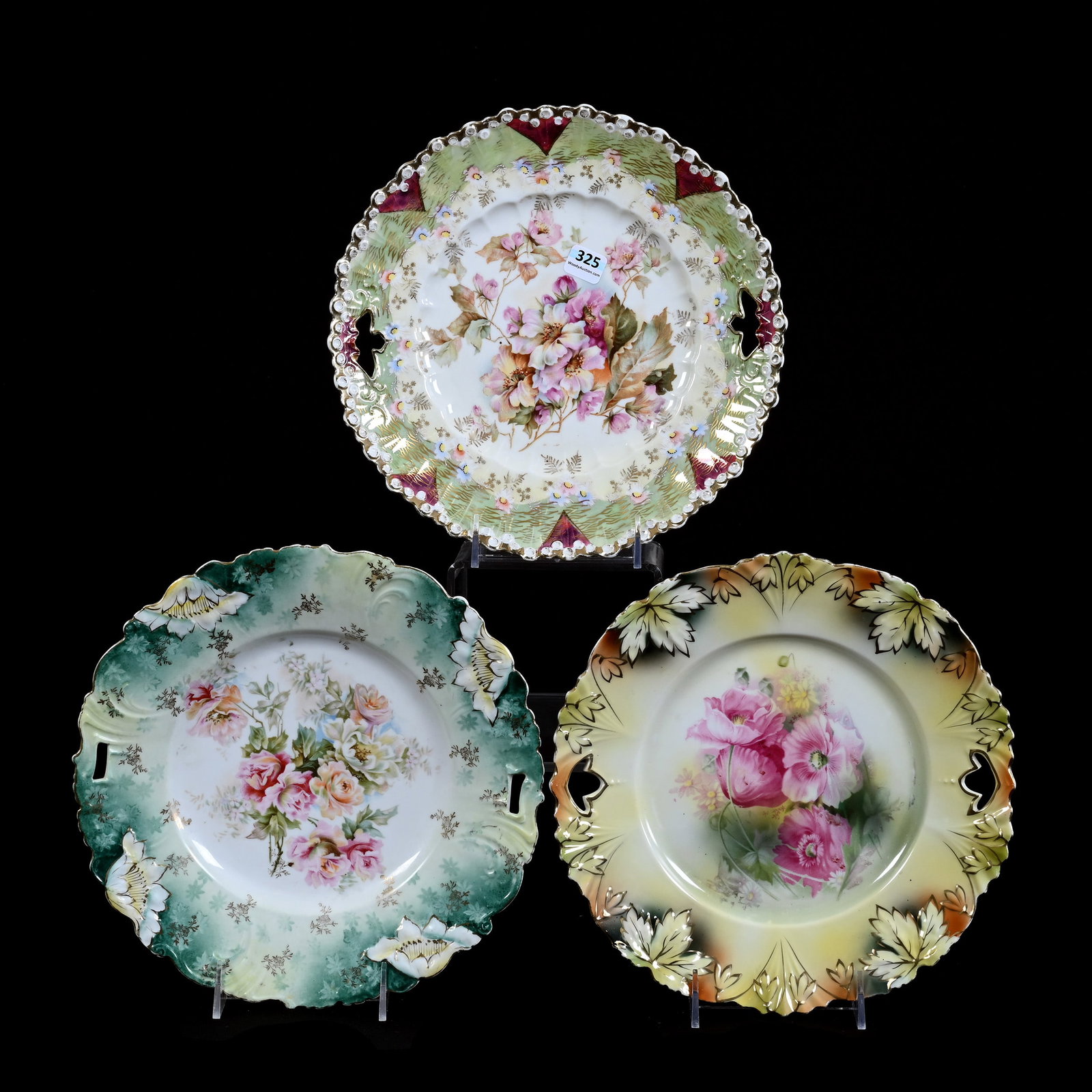 (3) Cake Plates, Prussia With Various Marks, Assorted Floral Decors And Colors: (3) Cake Plates, Prussia With Various Marks, Assorted Floral Decors And Colors, 10.5", (1) Unmarked, Lollipop Mold, (1) Marked R.S. Prussia, Maple Leaf Mold, (1) Unmarked, Poppy Variation Mold, Kansas