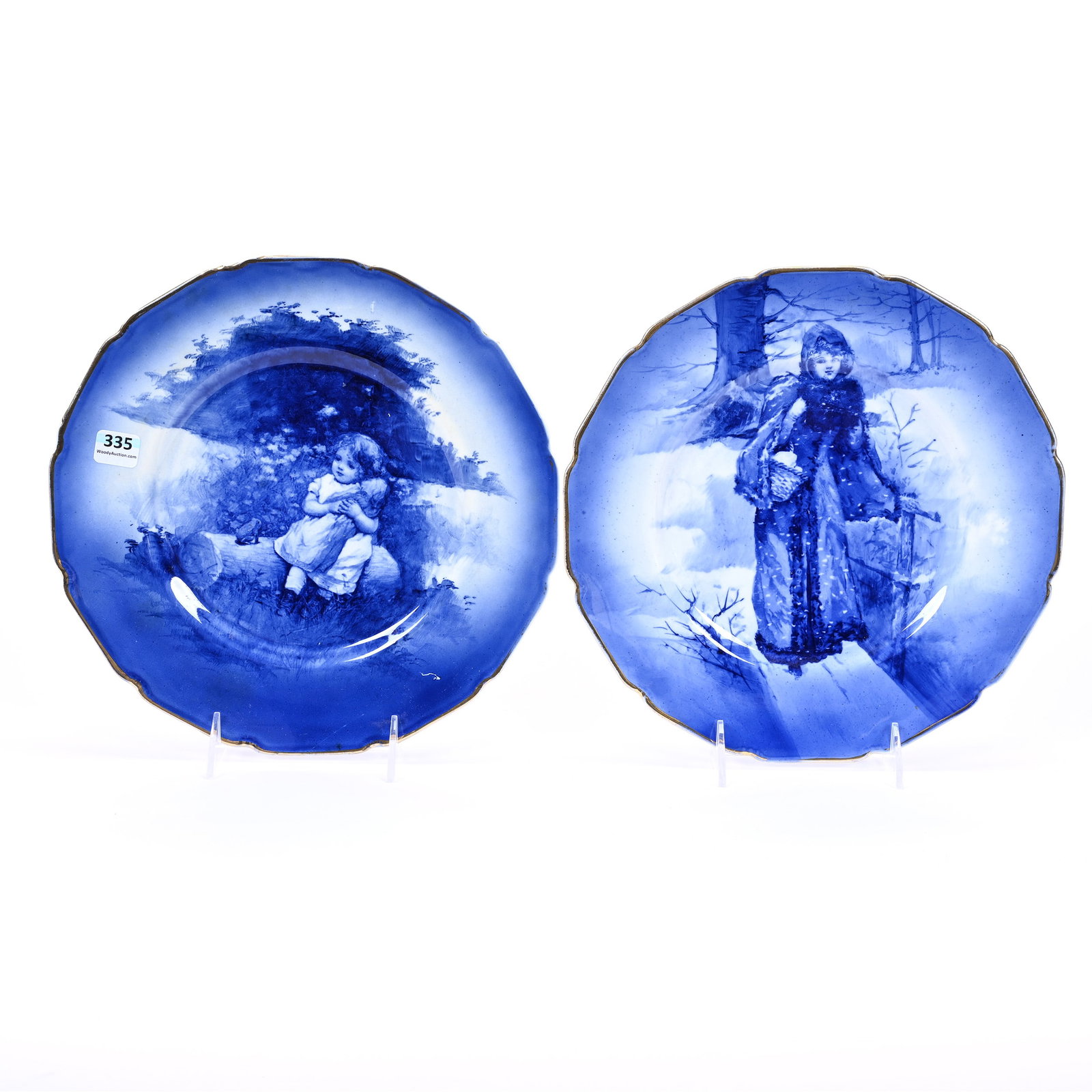 Two Plates Marked Royal Doulton, Flow Blue: Two Plates Marked Royal Doulton, Flow Blue, 10.5", (1) Portrait Of Young Girl Sitting On Log, (1) Winter Scene, Young Woman Crossing Bridge, Kansas Private Collection.