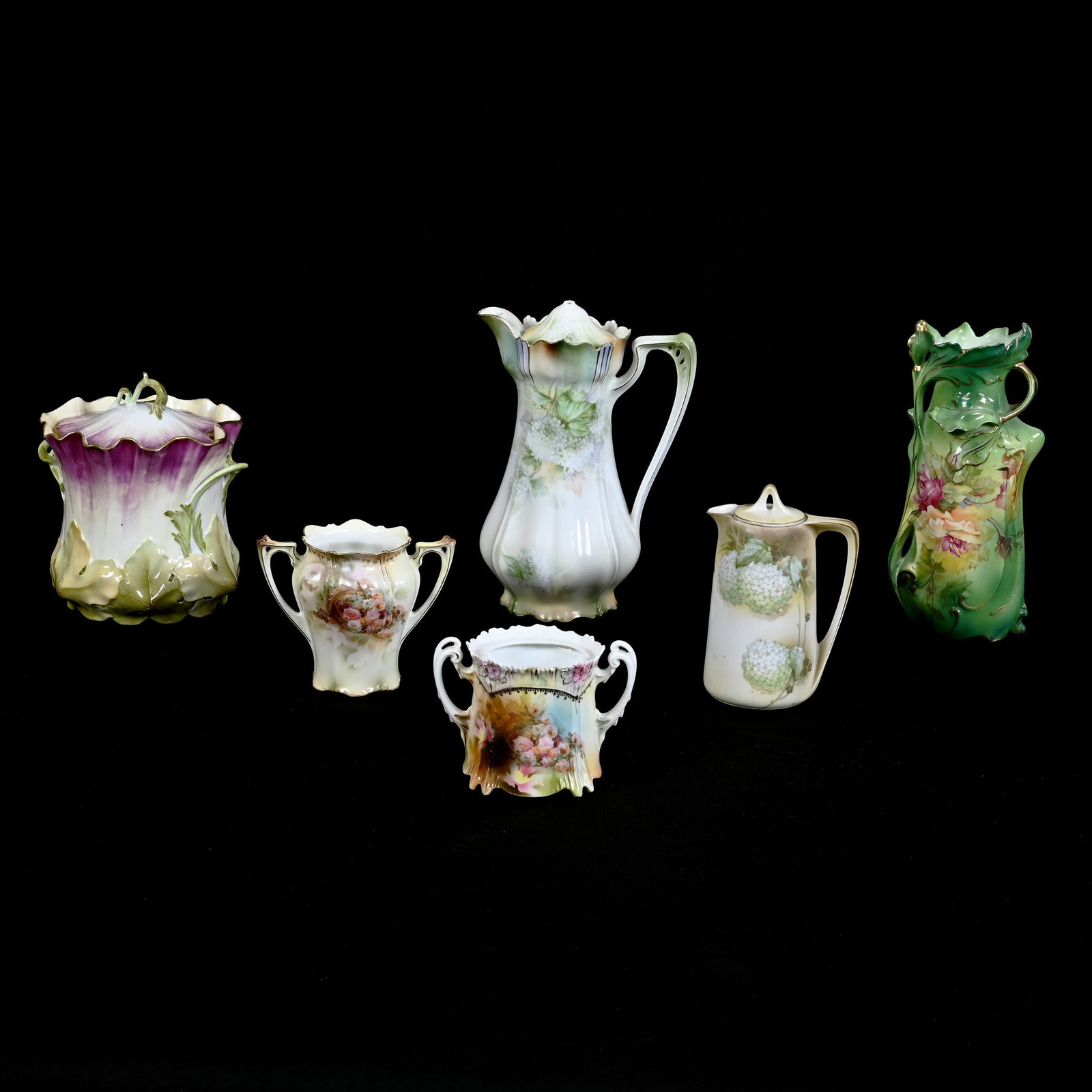 (6) R.S. Prussia Items: (6) R.S. Prussia Items, (1) Chocolate Pot With Broken Finial, (1) Biscuit Jar With Serious Cracked Base, (1) Icicle Mold Sugar Bowl, No Lid, (1) 6" x 4" Cream Pitcher With Lid Marked R.S. Germany (1) 