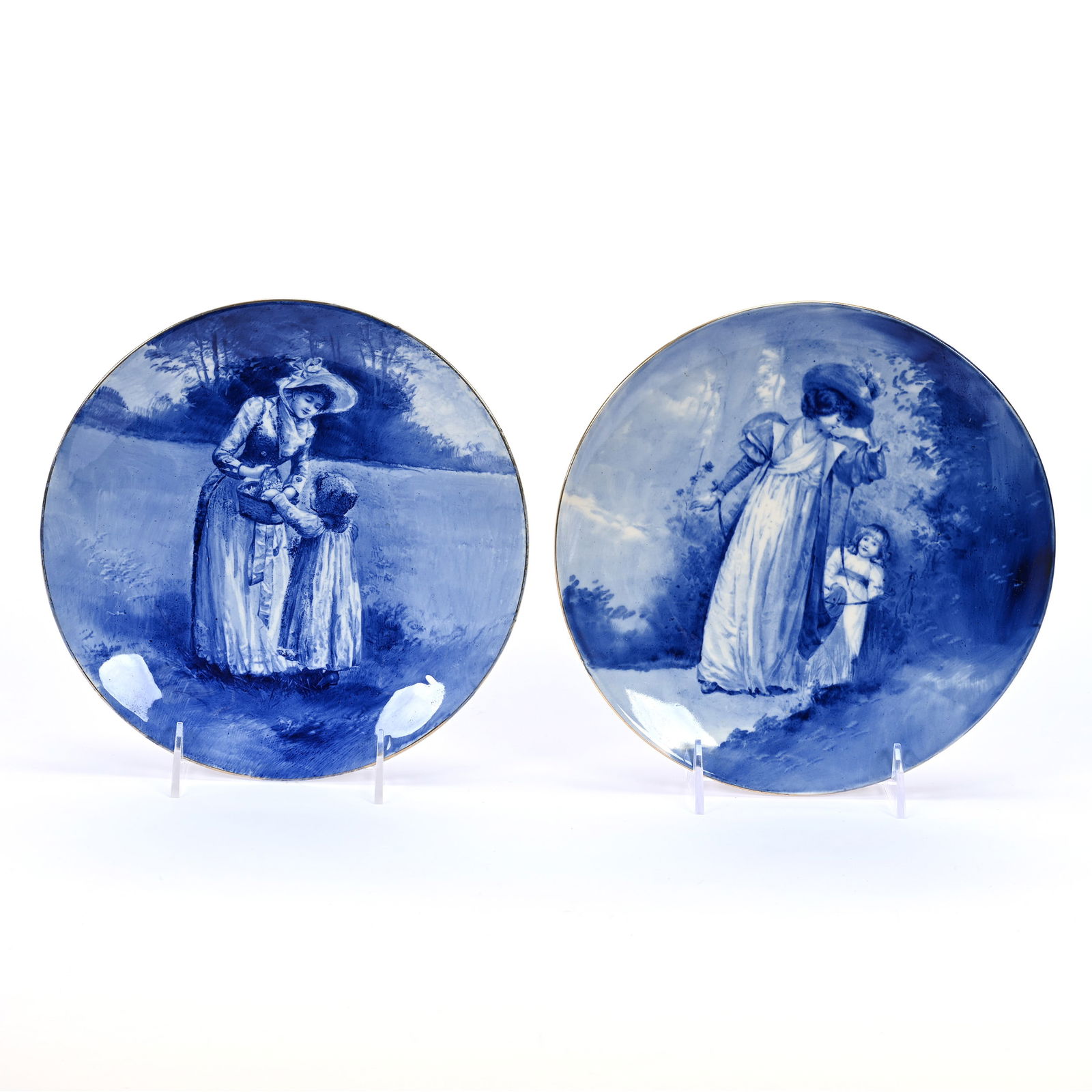 (2) Plates Marked Royal Doulton: (2) Plates Marked Royal Doulton, 9" approximately, Flow Blue, Babes In Woods (1) Mother And Child With Basket, (1) Mother And Child Playing, Kansas Private Collection.