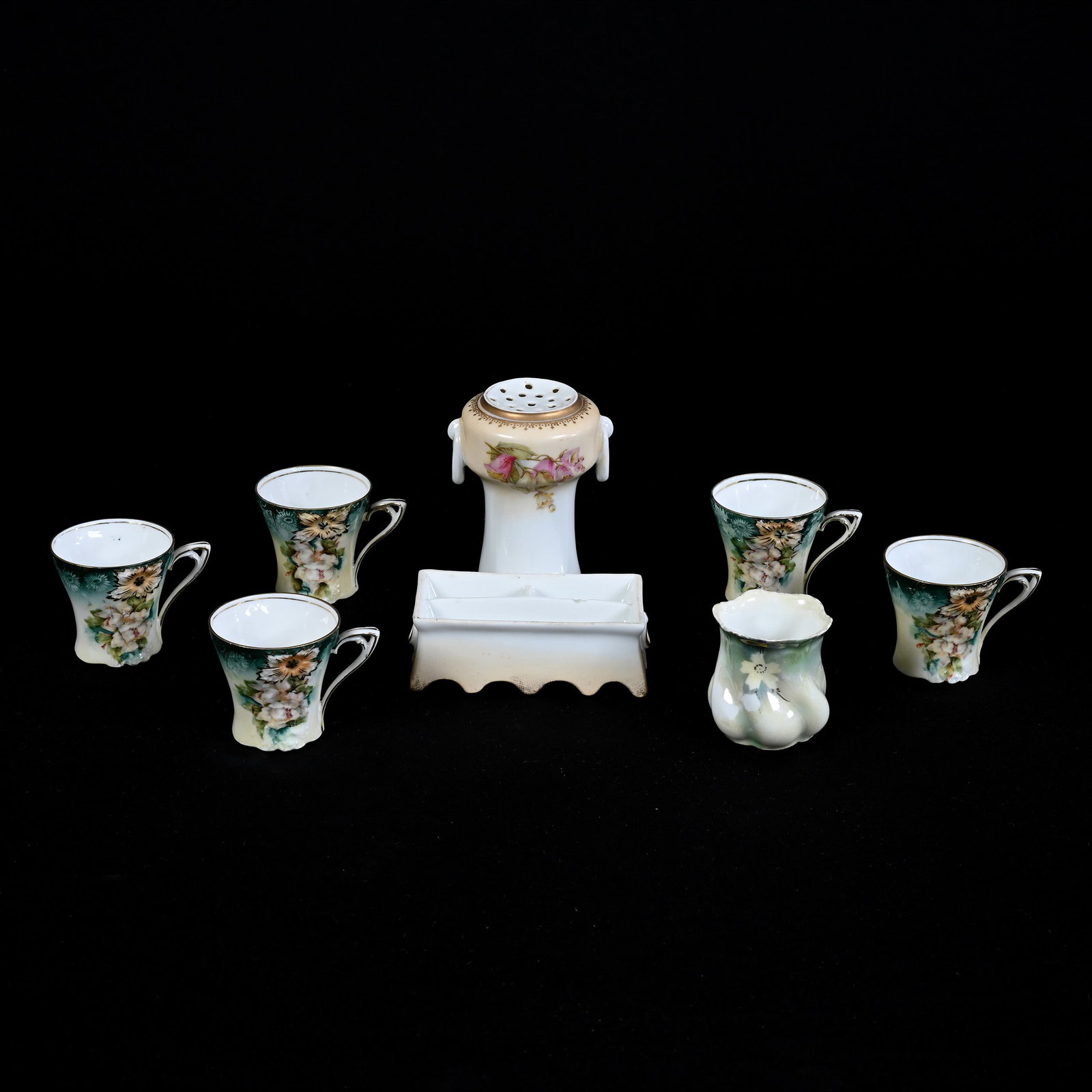 (7) R.S. Prussia Items: (7) R.S. Prussia Items, (1) 4.5" x 4.5" Hat Pin Holder With Attached Pin Dish, No Lid, Marked R.S. Prussia, (5) 2" Demitasse Cup, Carnation Mold, (1) 2" Toothpick Holder, Unmarked, Dogwood Decor, Kans
