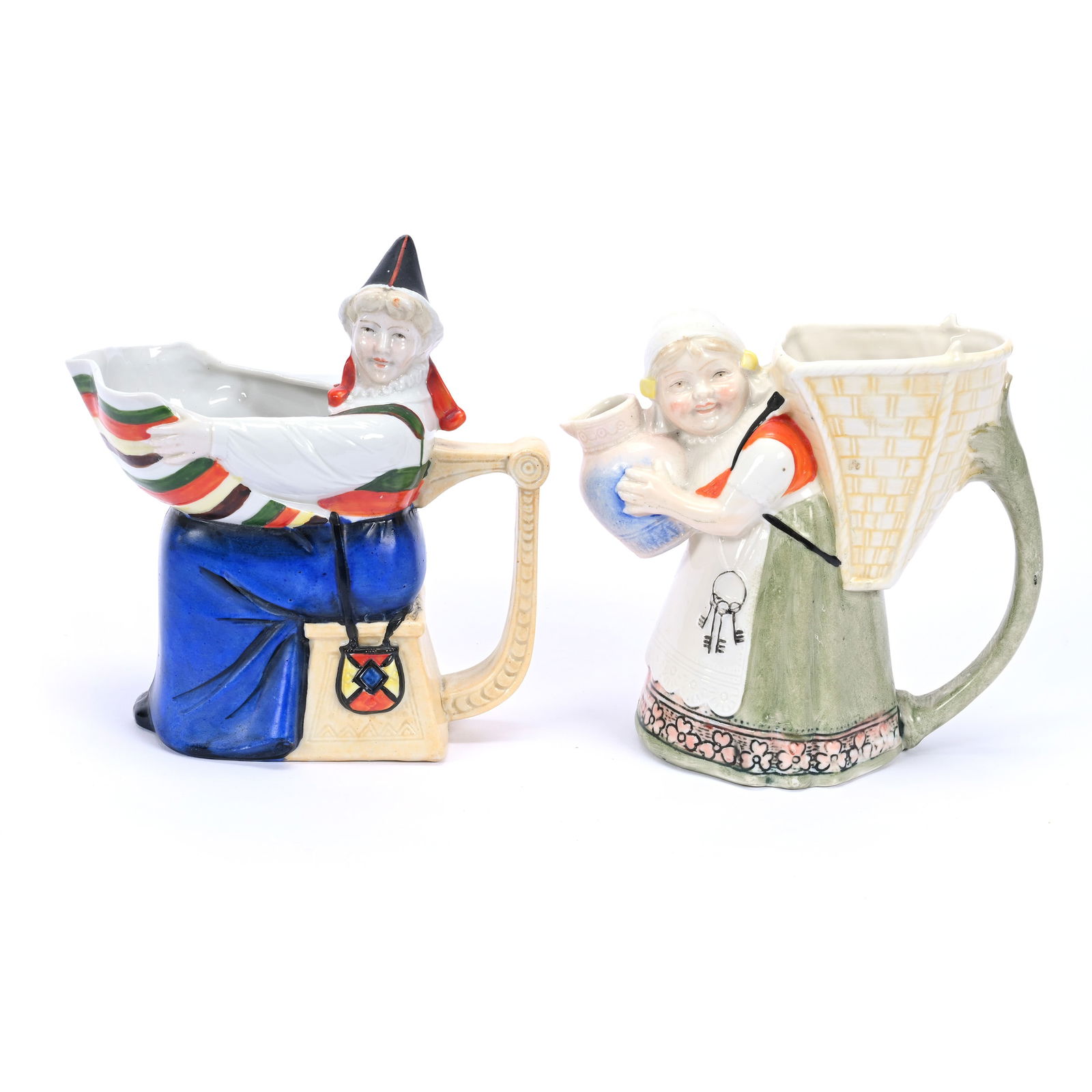 Two Figural Milk Pitchers, Marked Schafer And Vater: Two Figural Milk Pitchers, Marked Schafer And Vater, (1) 6" Woman Holding Apron, (1) 5" Girl Holding Milk Jug, Kansas Private Collection.