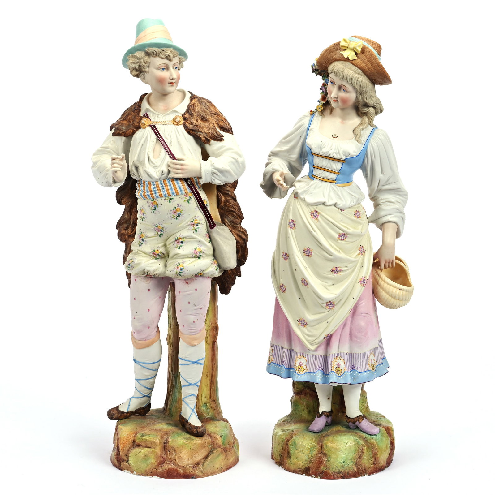 Pair French Bisque Figurines, Unmarked: Pair French Bisque Figurines, Unmarked, 20.5" x 7" approximately, Man Wearing Fur Cape And Woman Carrying Basket, Woman Missing Tips Of Three Fingers, Kansas Private Collection.