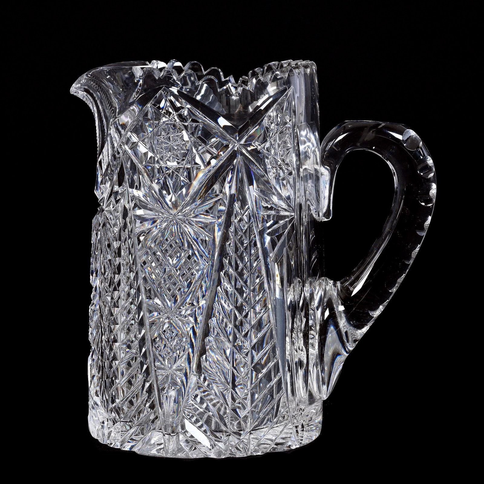 Pitcher, American Brilliant Cut Glass, Herringbone, Hobstar, Crosscut Diamond And Fan Motif: Pitcher, American Brilliant Cut Glass, Herringbone, Hobstar, Crosscut Diamond And Fan Motif, 8.75" x 7.25", Double Notched Handle, Ray Cut Base, Some Pattern Chips, Collection Of The Late T. J. Wilson