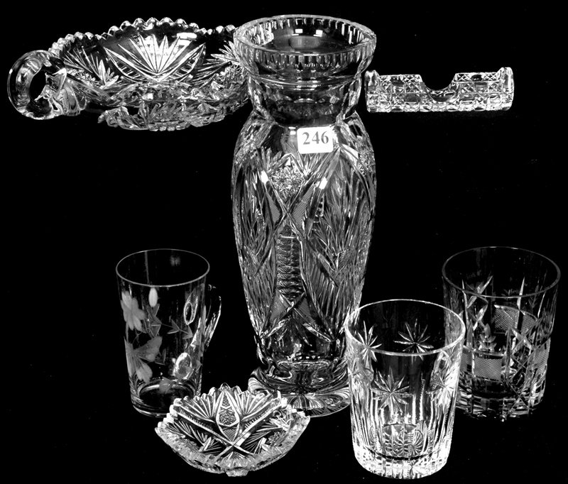 (7) CUT GLASS ITEMS: (7) CUT GLASS ITEMS (1) 10 1/4" WATERFORD STYLE VASE - (2) TUMBLERS (ONE CHIPPED) - (1) HANDLED MUG WITH BUTTERFLY DECOR - (1) 3 1/2" EIGHT-SIDED BUTTER PAT - (1) 4" CANE PATTERN TOOTHPICK HOLDER - (1