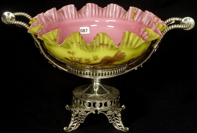 9 1/2" X 16" BRIDES BASKET WEBB PINK AND GREEN CASE: 9 1/2" X 16" BRIDES BASKET WEBB PINK AND GREEN CASED ART GLASS RUFFLES BOWL WITH FANCY ENAMEL FLORAL DECOR SET ON MARKED PAIRPOINT PEDESTAL FRAME, BOWL WITH SERIOUS VERTICAL RUFFLE REPAIR