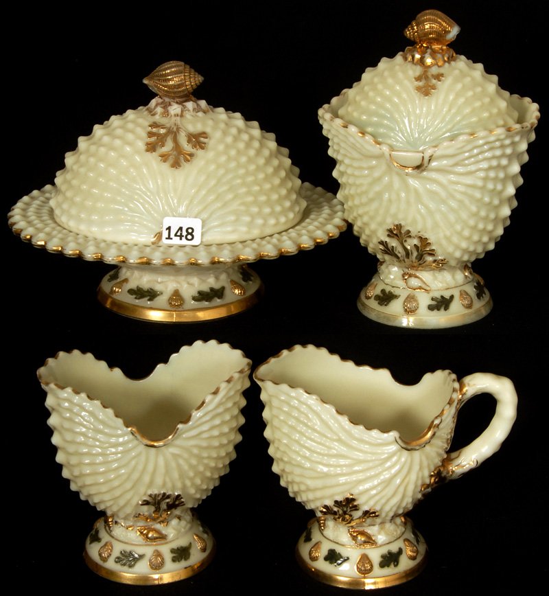 FOUR PIECE NORTHWOOD CUSTARD GLASS ARGONAUT SHELL : FOUR PIECE NORTHWOOD CUSTARD GLASS ARGONAUT SHELL PATTERN TABLE SET BUTTER DISH, CREAMER, SUGAR AND SPOONER, NICE COLORED HIGHLIGHTS, SUGAR LID WITH FINIAL CHIP