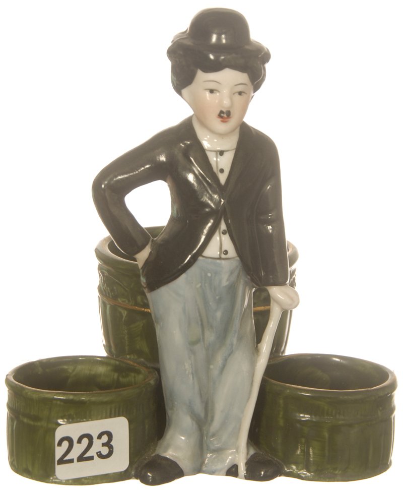 5 1/4" UNMARKED GERMAN FIGURAL SMOKE SET, CHARLIE : 5 1/4" UNMARKED GERMAN FIGURAL SMOKE SET, CHARLIE CHAPLIN STANDING IN FRONT OF CIGARETTE AND MATCH HOLDER
