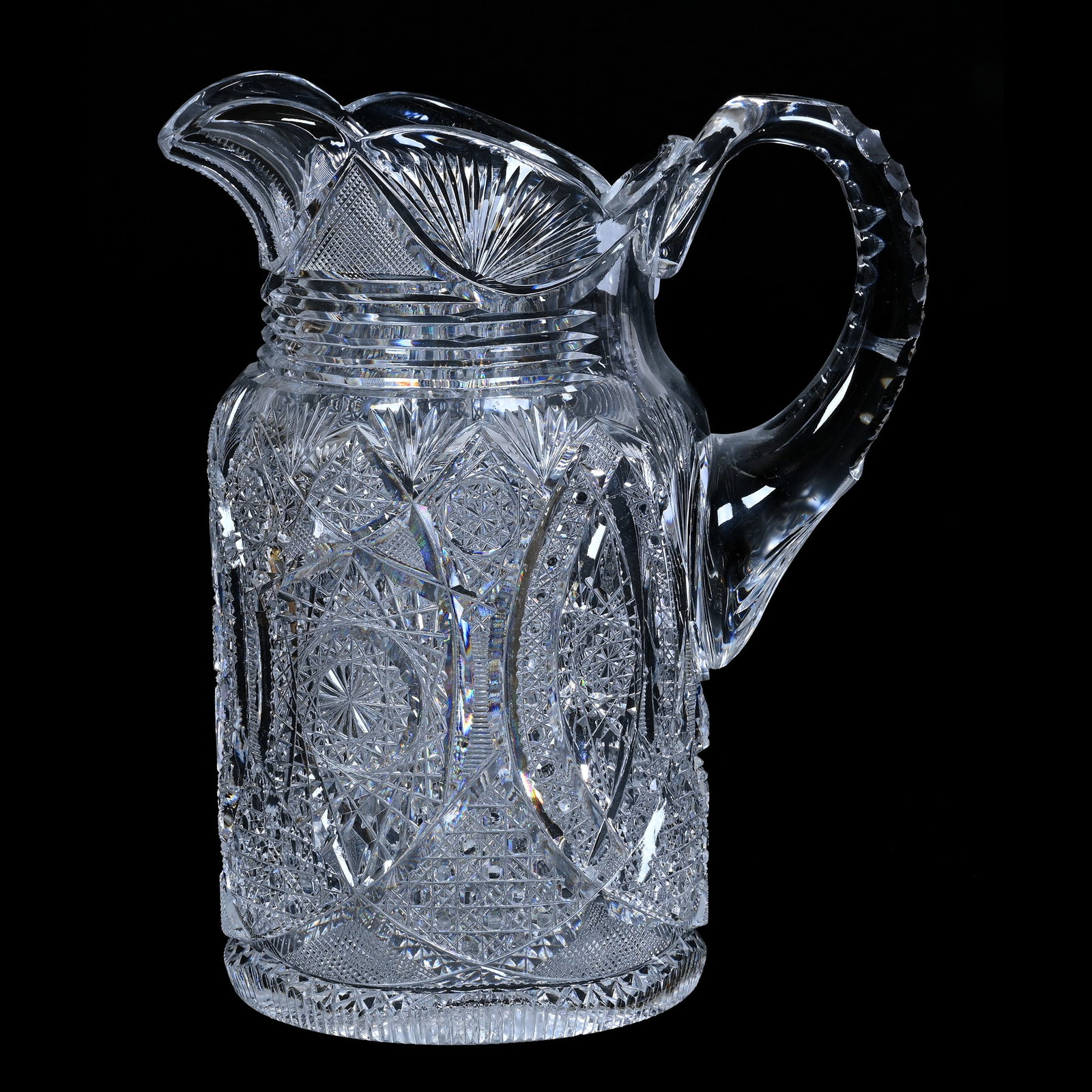 Pitcher, American Brilliant Cut Glass, Superbly Cut Hobstar, Vesica, Cane, Zipper And Fan Motif: Pitcher, American Brilliant Cut Glass, Superbly Cut Hobstar, Vesica, Cane, Zipper And Fan Motif, 9.75" x 8", Triple Notched Handle, Hobstar Base, Maurine and The Late Al Edmond Collection, IA.