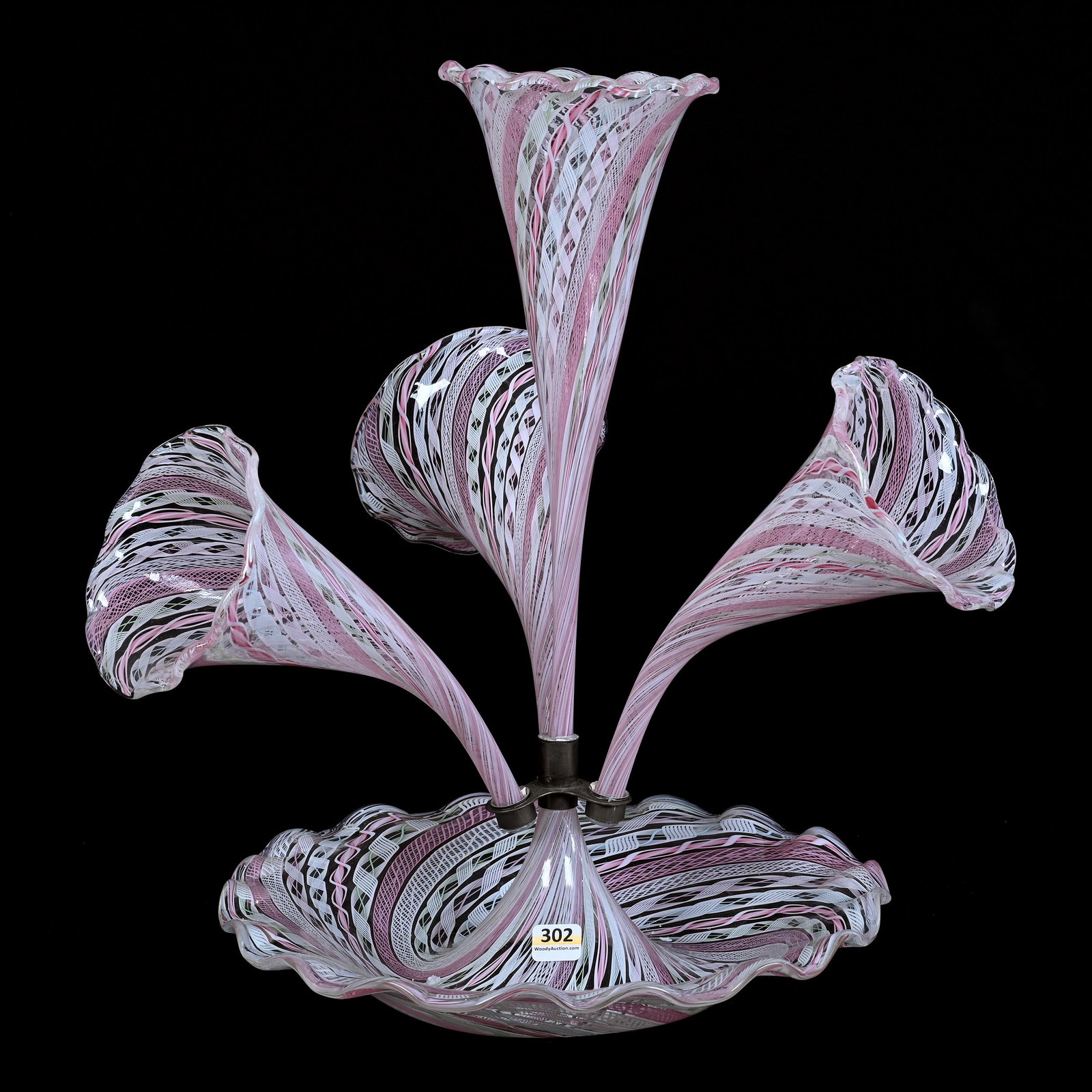 Centerpiece Epergne, Four Lily, Murano Glass, Clear With Extensive Pink Latticino Ribbon Design: Centerpiece Epergne, Four Lily, Murano Glass, Clear With Extensive Pink Latticino Ribbon Design, 16.5" x 15.5" x 12", Various Color Highlights, The Late Bunny Koppelman Whose Epergne Collection Was Fe