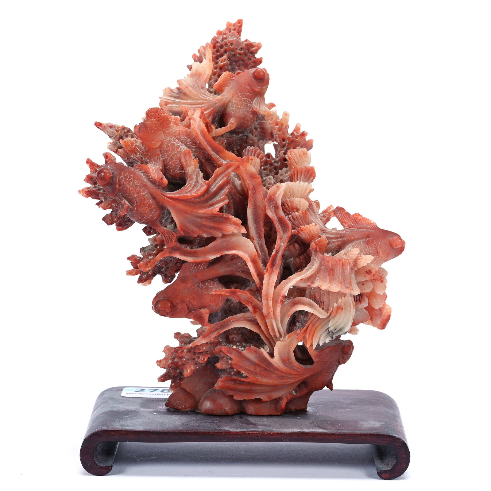 Carved Soapstone, Coral Color In Coral Reef Design: Carved Soapstone, Coral Color In Coral Reef Design, 5.5" x 4.5" x 3", Teakwood Base/Stand, The Estate Of Rex And Mary Campbell, MO. All Proceeds Of This Auction Go To Benefit Low Income Students At Un
