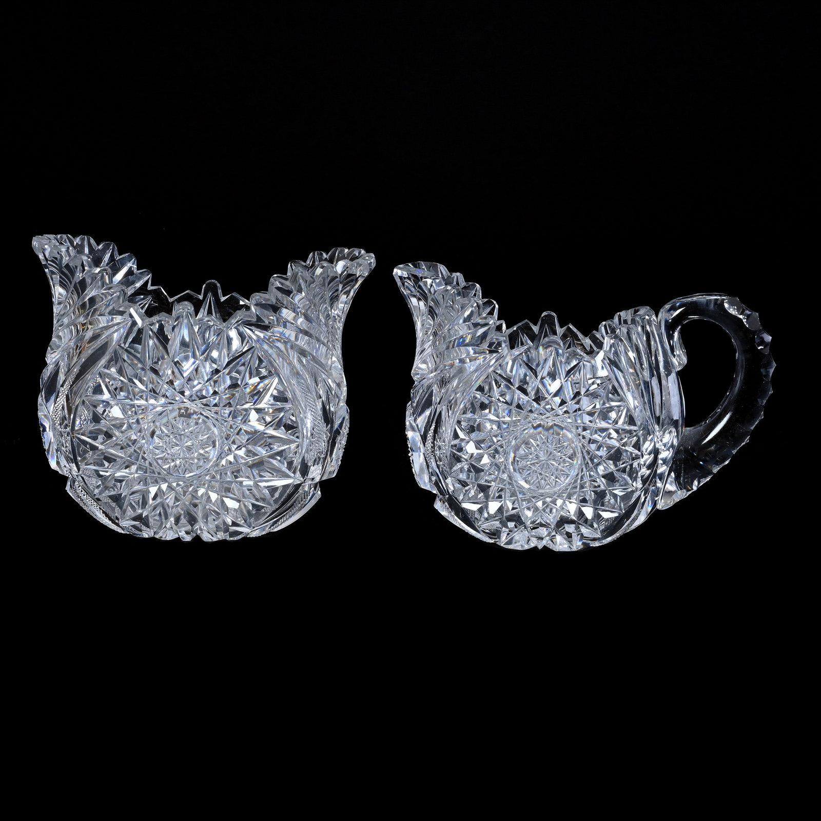 Oval Creamer And Sugar, American Brilliant Cut Glass: Oval Creamer And Sugar, American Brilliant Cut Glass, 4.25" x 5.75, Large Hobstar With Strawberry Diamond, Fan And Miter Highlights, Triple Notched Handle, Tooth Chip On Sugar, Grady And Annette Hite 