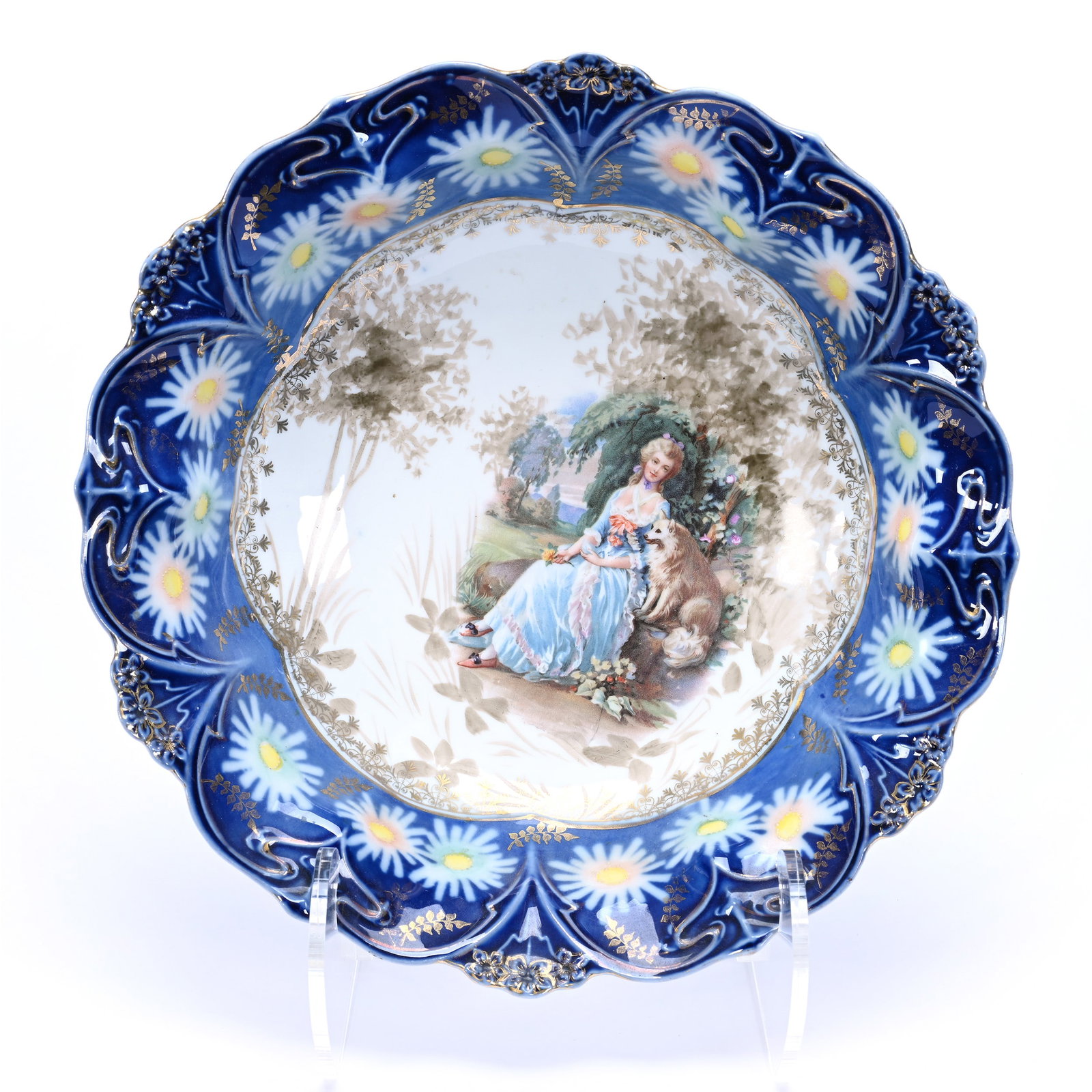 Bowl, Unmarked R.S. Prussia, Scene Of Woman Seated With Dog, Cobalt Blue Border: Bowl, Unmarked R.S. Prussia, Scene Of Woman Seated With Dog, Cobalt Blue Border, 10.5", Daisy Highlights, Grady And Annette Hite Collection, NC.