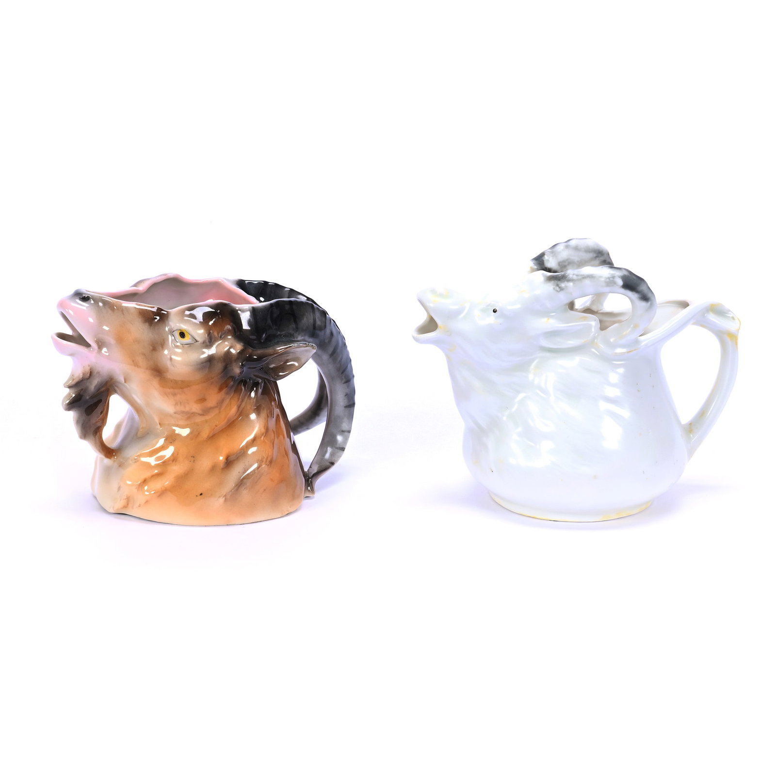 Two Figural Creamers, Royal Bayreuth: Two Figural Creamers, Royal Bayreuth, (1) 3.75" X 5.25" Mountain Goat, Brown Tones, Blue Mark, (1) 4.25" X 5.5" Goat, White Satin, Unmarked, Grady And Annette Hite Collection, NC.
