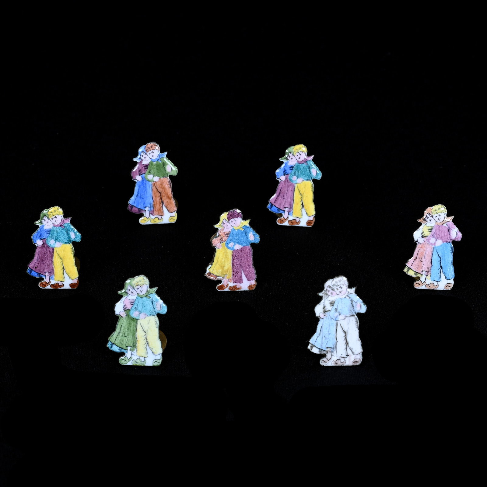 Seven French Enamel Figural Place Card Holders, Dutch Boy And Girl Design: Seven French Enamel Figural Place Card Holders, Dutch Boy And Girl Design, 1" x 1", Grady And Annette Hite Collection, NC.