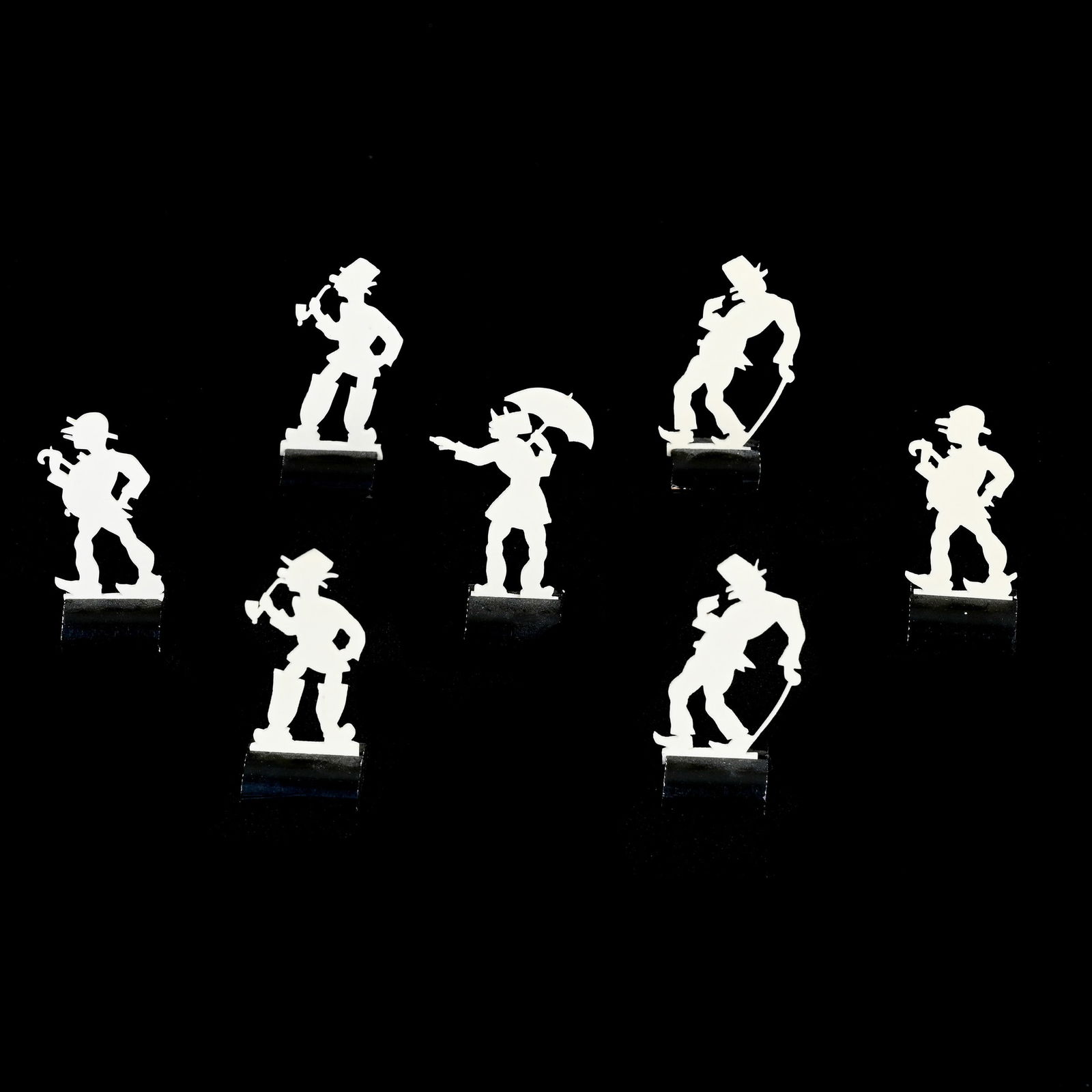 Seven Celluloid Cut Out Designs With Ebony Bases: Seven Celluloid Cut Out Designs With Ebony Bases, Approximately 2" x 1", Grady And Annette Hite Collection, NC.