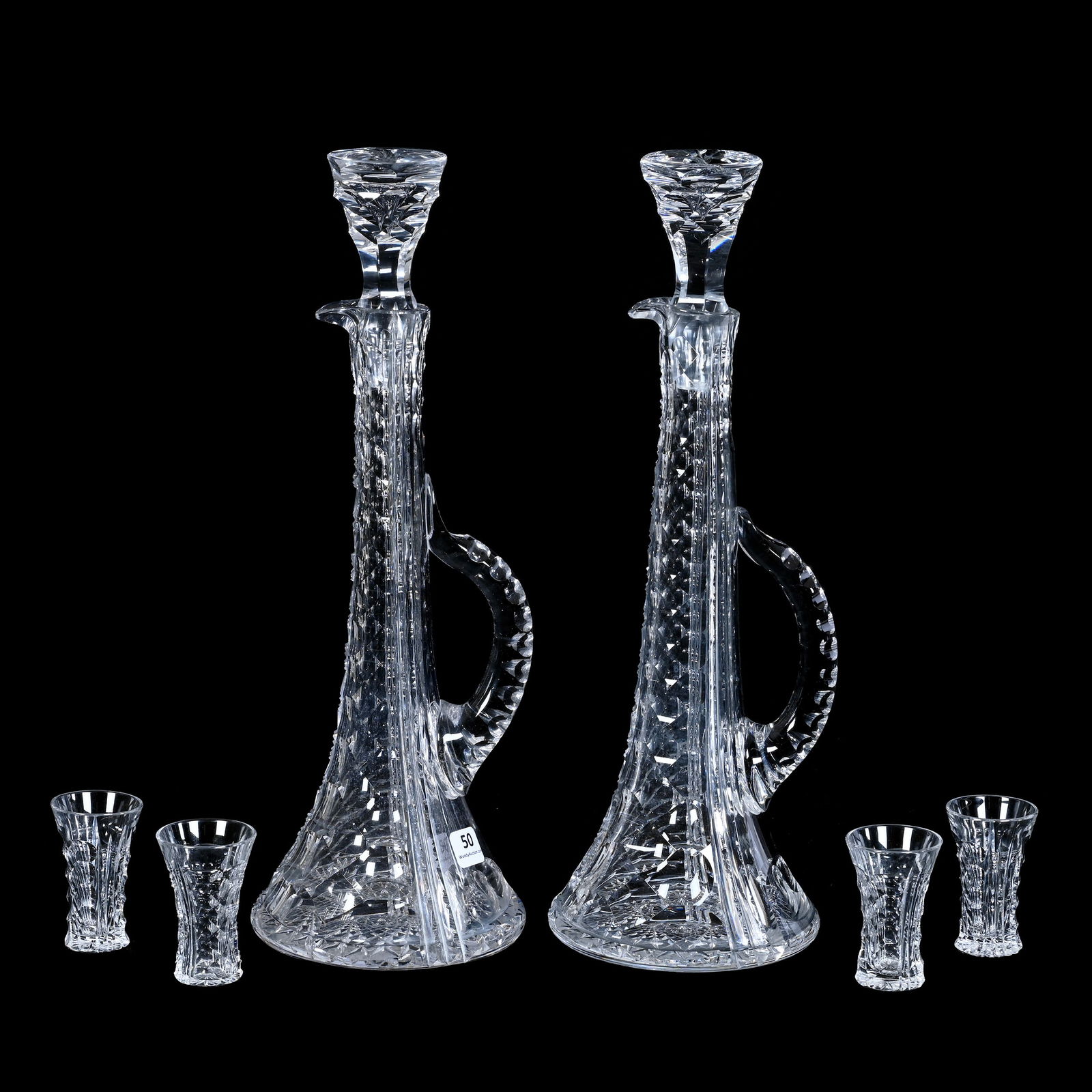 Double Decanter Set, American Brilliant Cut Glass, Corona Pattern By Pairpoint, Rare Thin Neck Form: Double Decanter Set, American Brilliant Cut Glass, Corona Pattern By Pairpoint, Rare Thin Neck Form, Honeycomb And Prism Motif, Double Notched Handles, Hobstar Base, Pattern Cut Stoppers, (2) 14.5" x