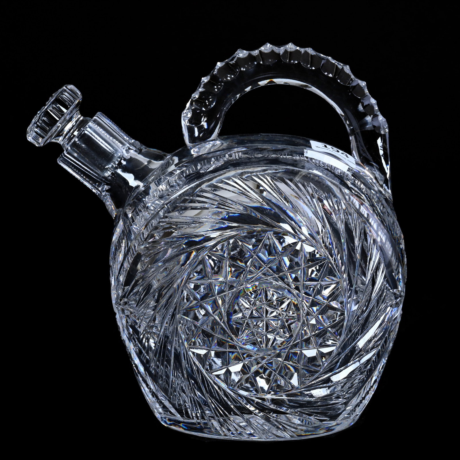 Rum Jug, American Brilliant Cut Glass, Large Pinwheel With Prism And Fan Highlights: Rum Jug, American Brilliant Cut Glass, Large Pinwheel With Prism And Fan Highlights, 6.75" x 6.75", Triple Notched Handle, Ray Cut Base, Quality Cut Stopper, California Private Collection.