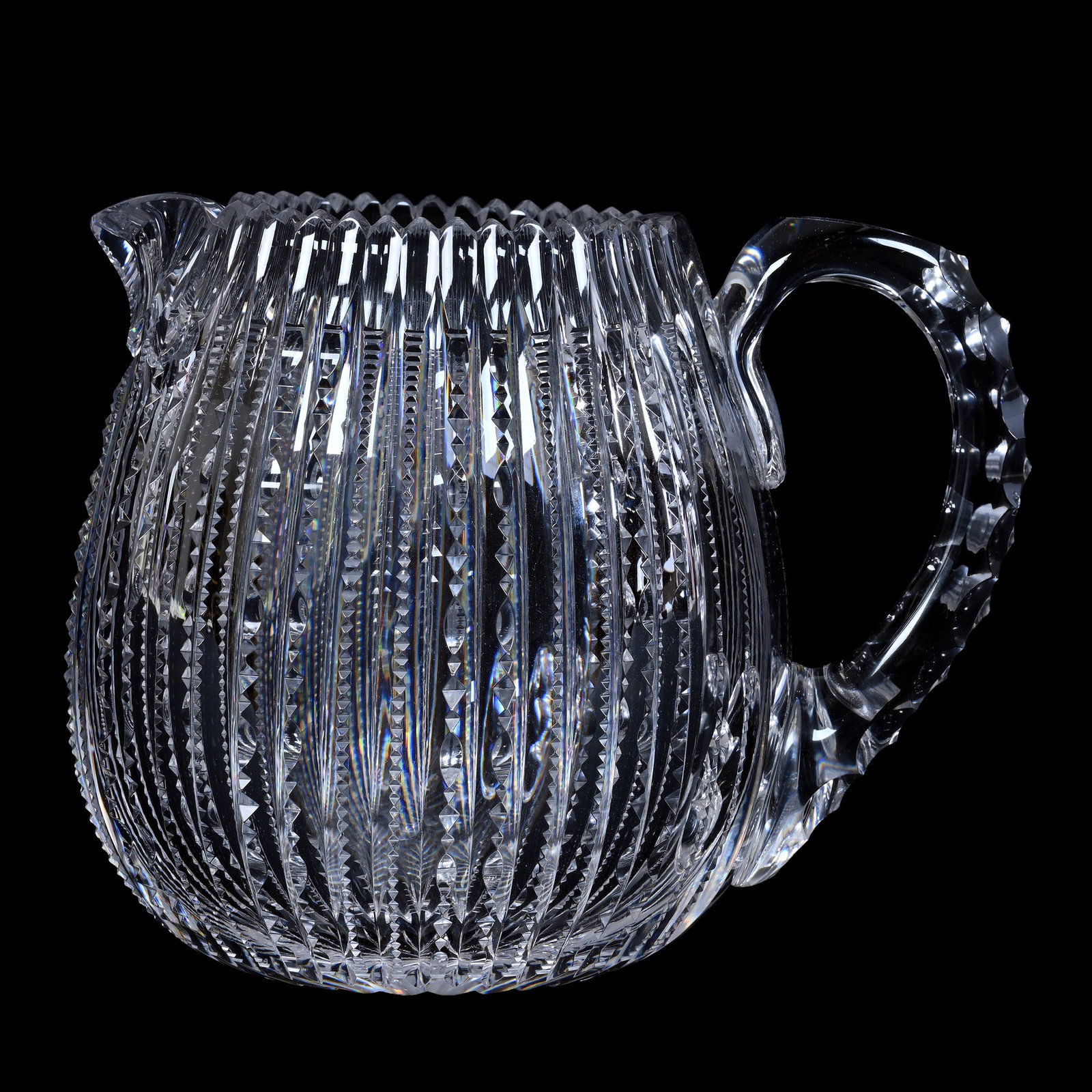 Cider Pitcher, American Brilliant Cut Glass, Barrel Shape Prism Cut Body: Cider Pitcher, American Brilliant Cut Glass, Barrel Shape Prism Cut Body, 6.5" x 8", Triple Notched Handle, Ray Cut Base, Estate Of Paul Pellet, Texas.