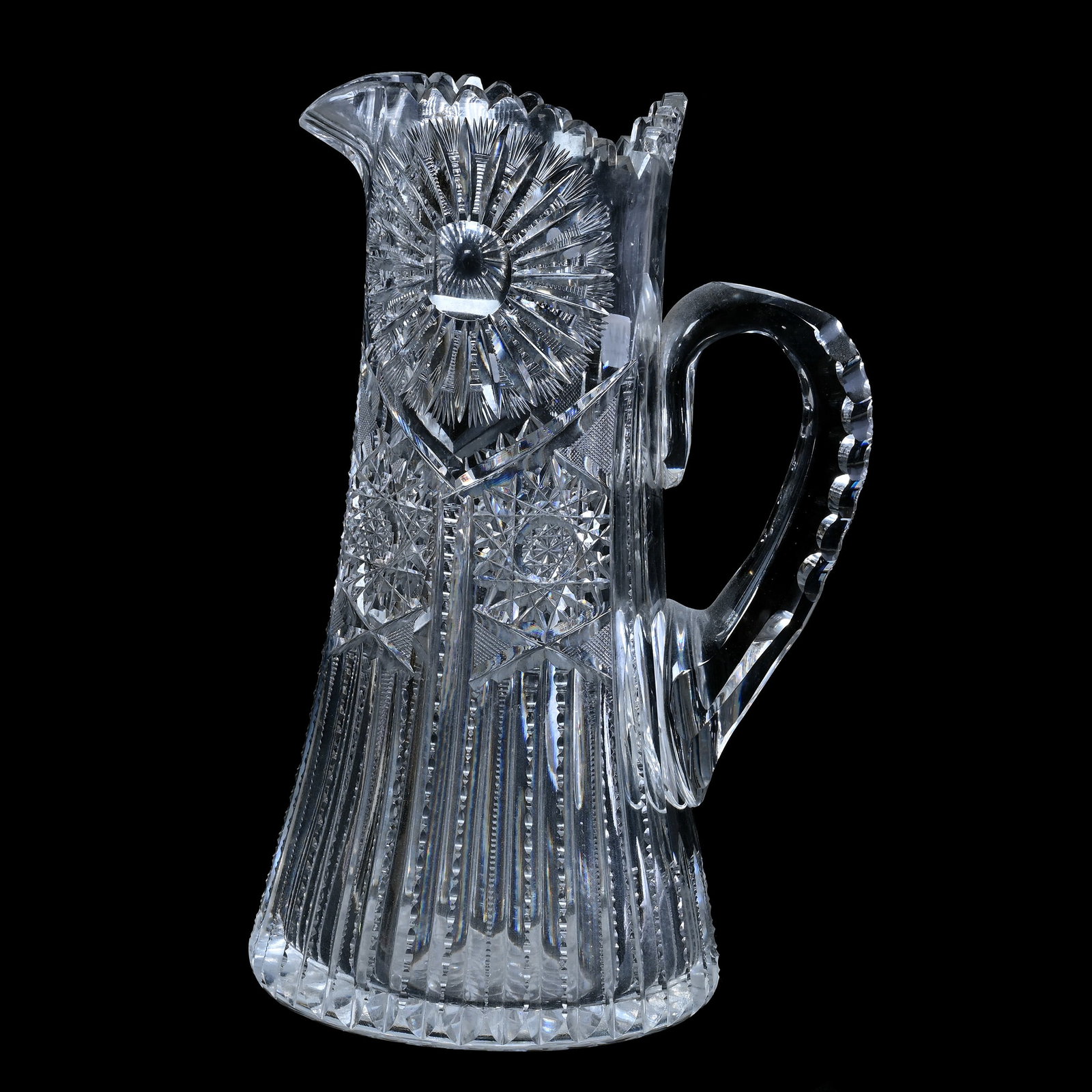 Tankard, American Brilliant Cut Glass, Sunburst, Hobstar And Prism Motif: Tankard, American Brilliant Cut Glass, Sunburst, Hobstar And Prism Motif, 11.75" x 7.5", Double Notched Crosshatch Handle, Hobstar Base, Estate of Paul Pellet, Texas.